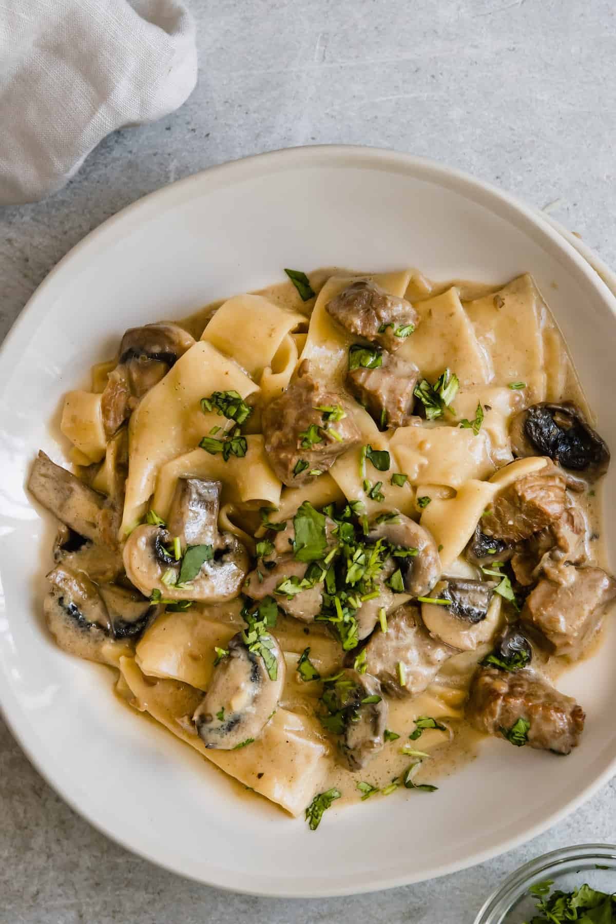 A Plate of Beef Stroganoff Garnished with Fresh Parsley
