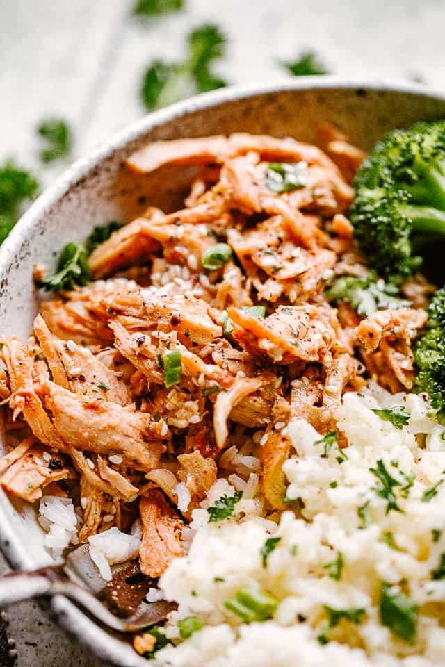 Close up of honey garlic chicken and rice in a bowl.