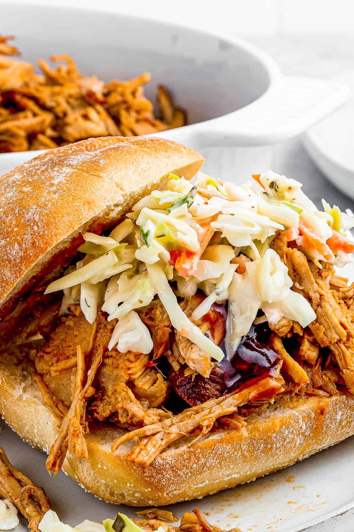 sandwich buns with pulled pork topped with coleslaw