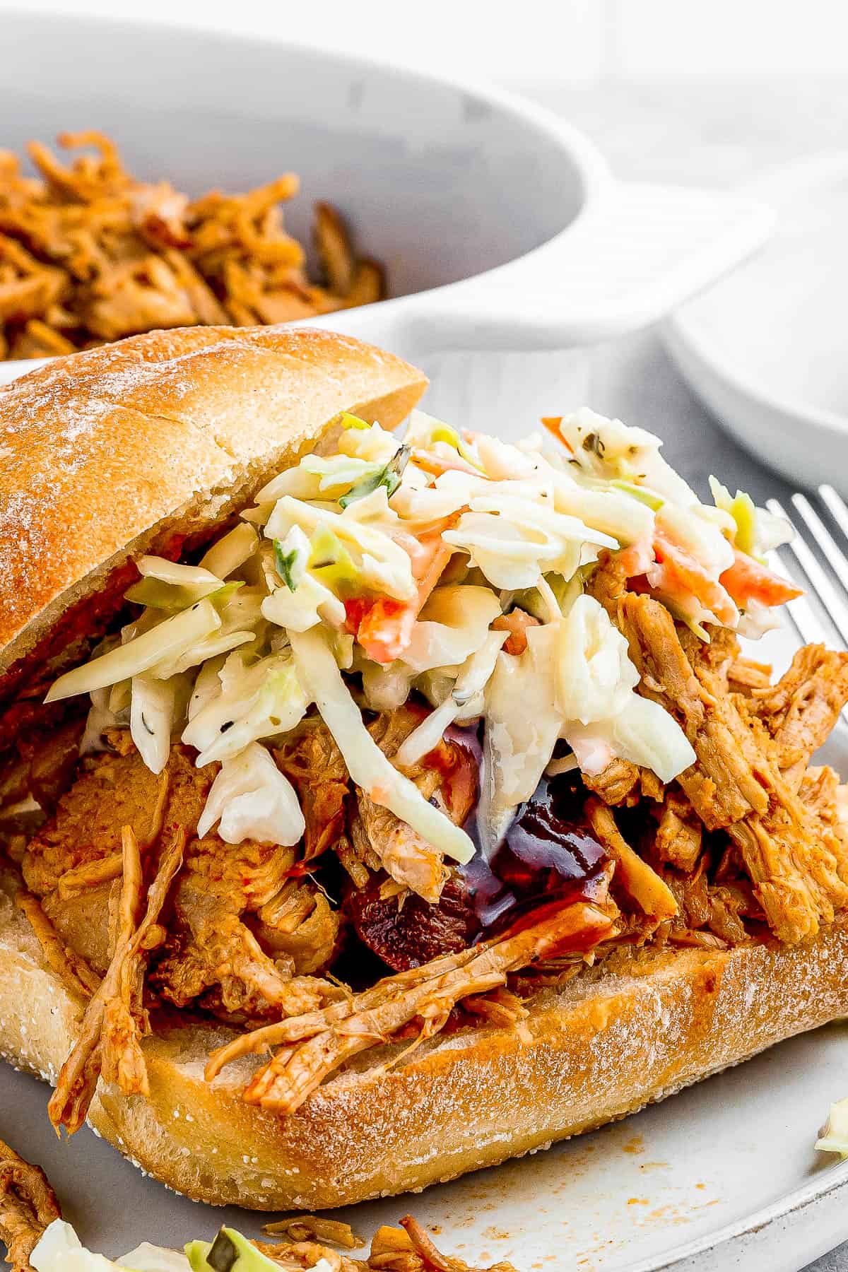 sandwich buns with pulled pork topped with coleslaw