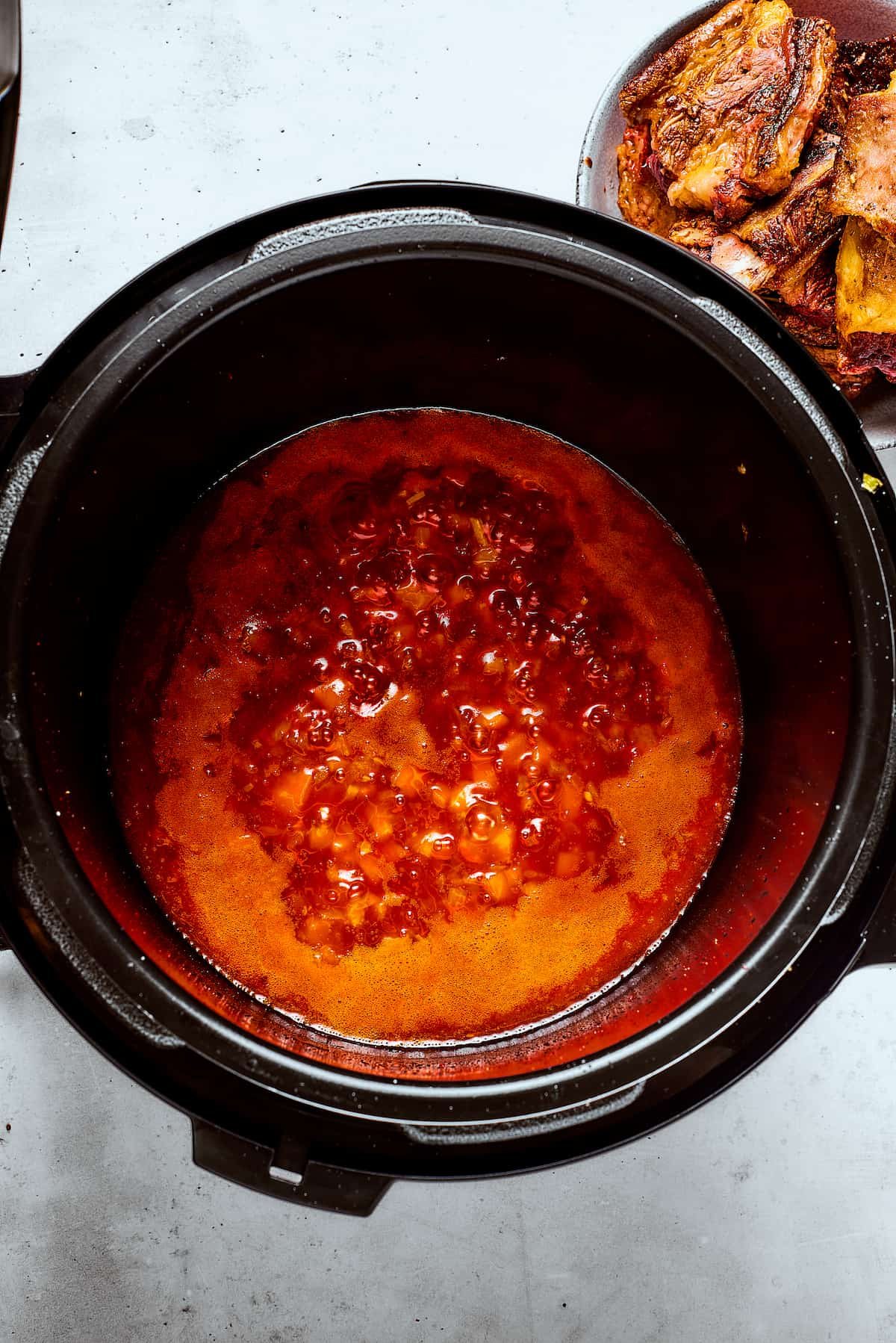 Simmering sauce in the pot.