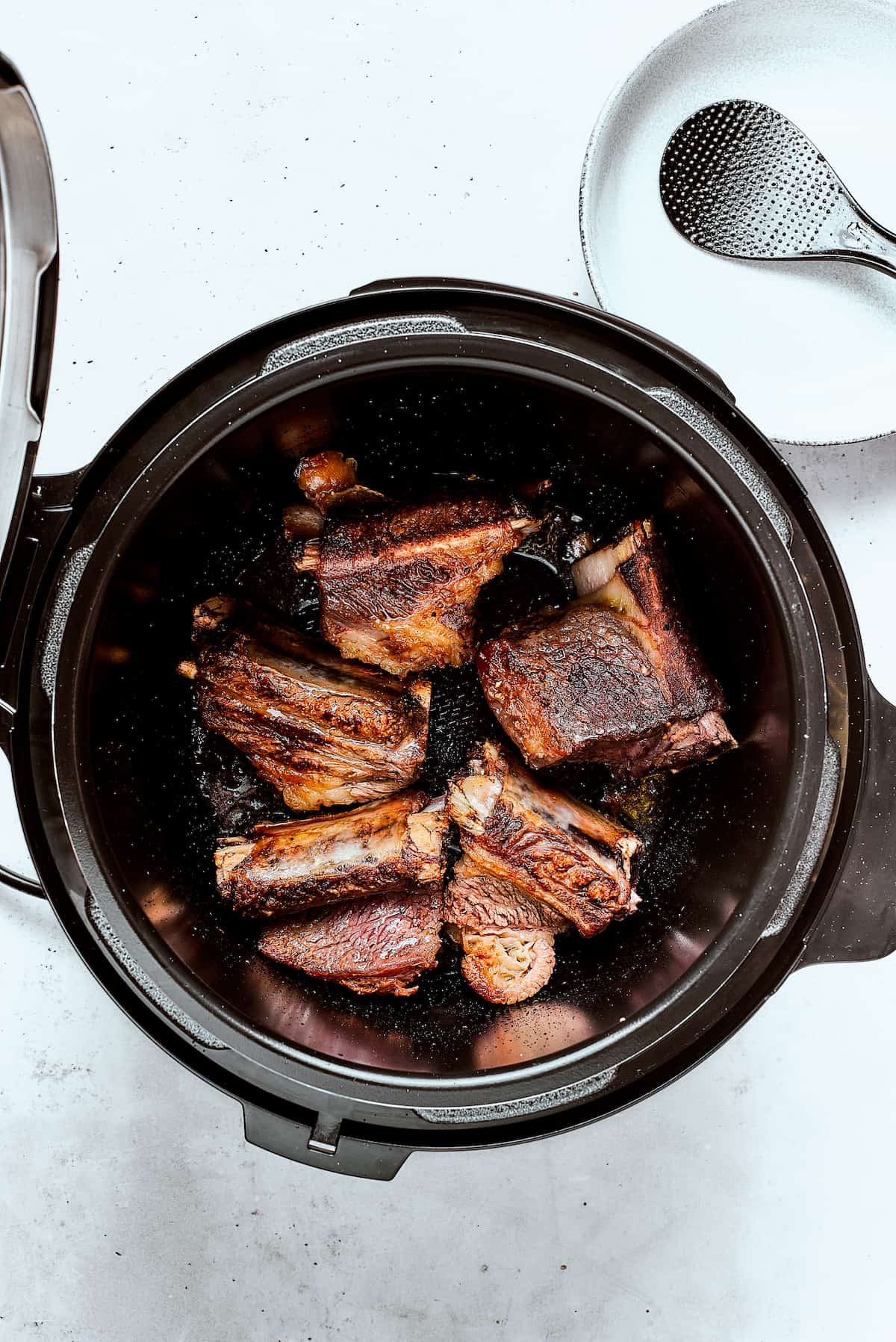 Seared short ribs in an instant pot.