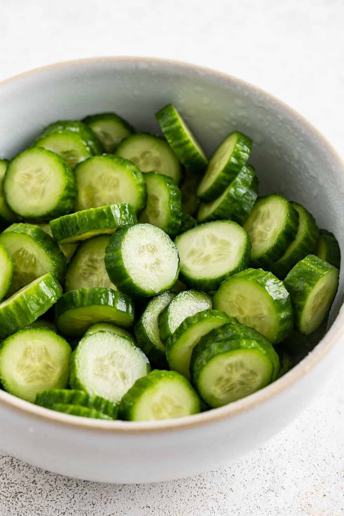 Salting the cucumbers.