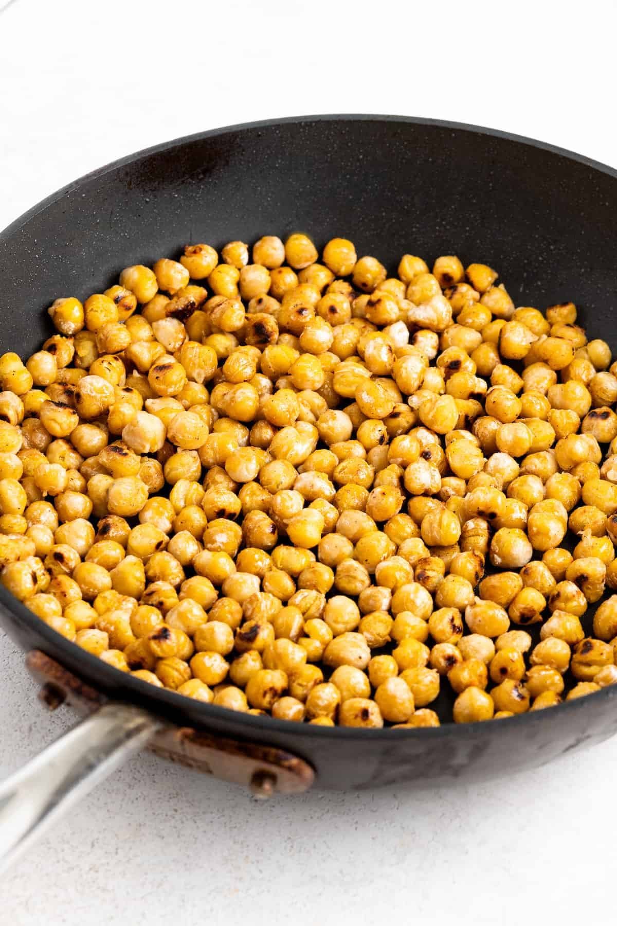Pan-roasting the chickpeas.