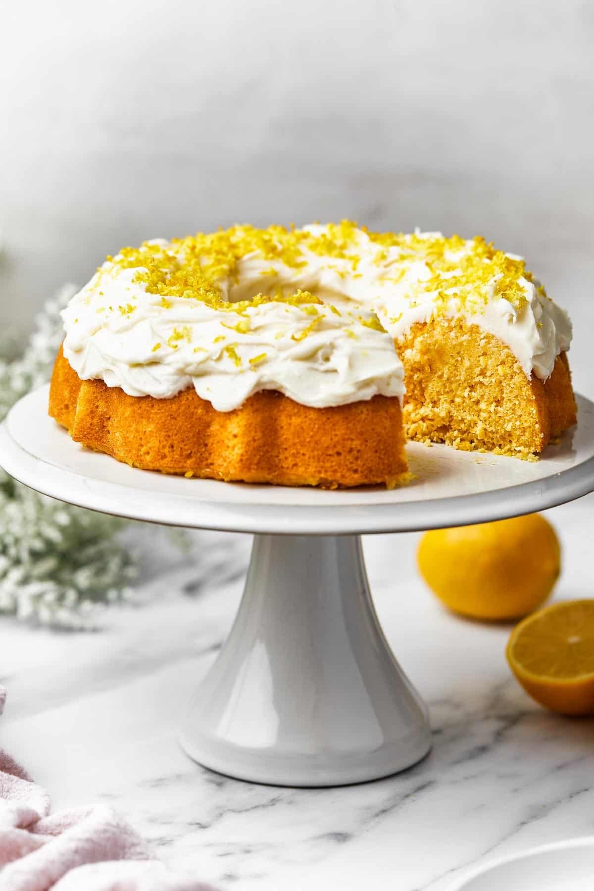 A Bundt cake on a platter, with one slice cut out.