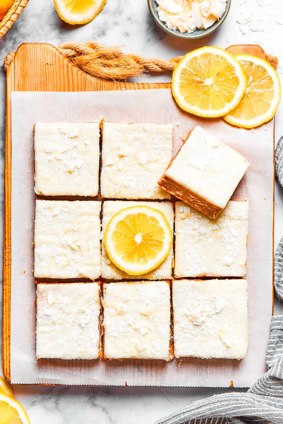 Squares of lemon slice topped with frosting.