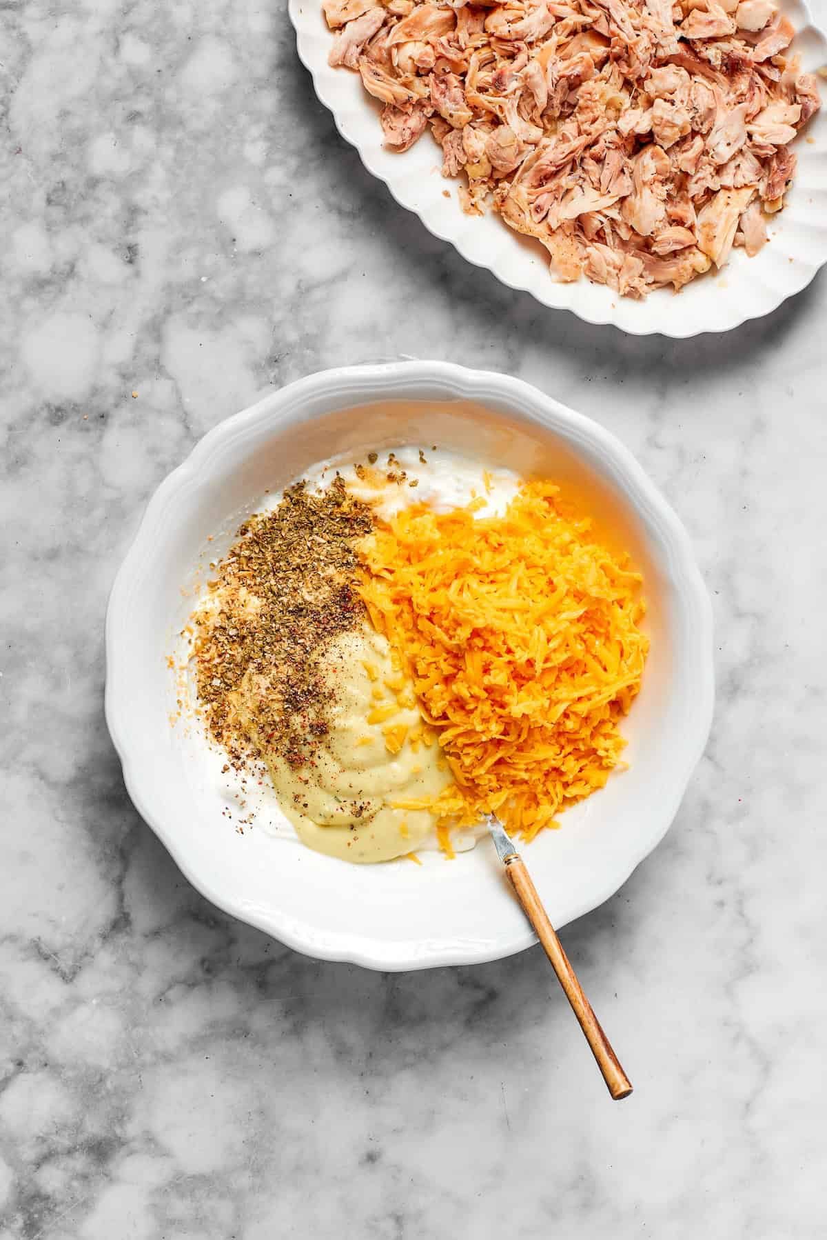 Cheese and seasonings are mixed together.
