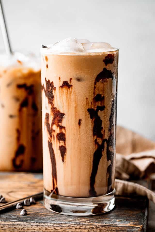 side shot of drinking glasses filled with iced coffee