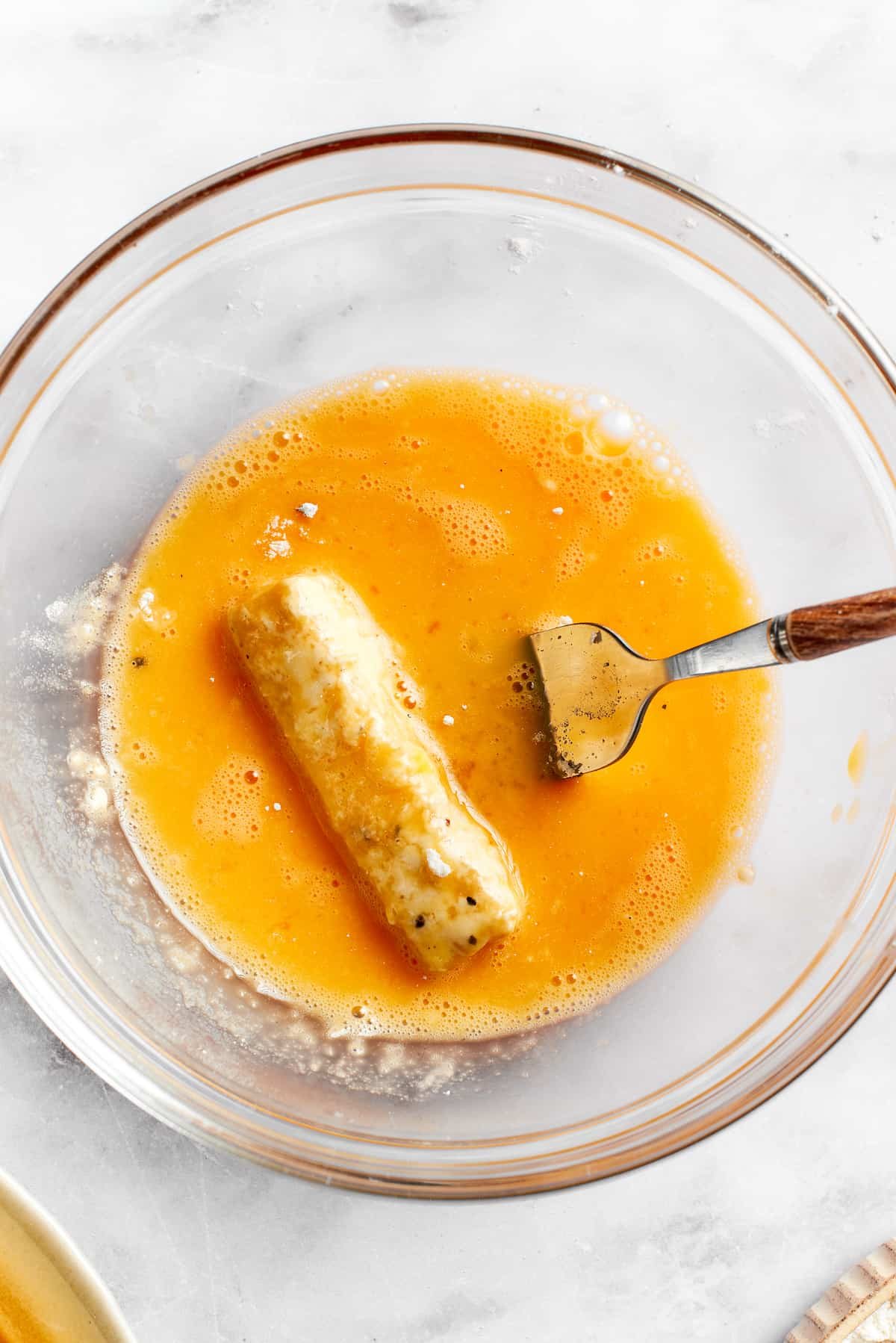 The cheese is added back to the egg.