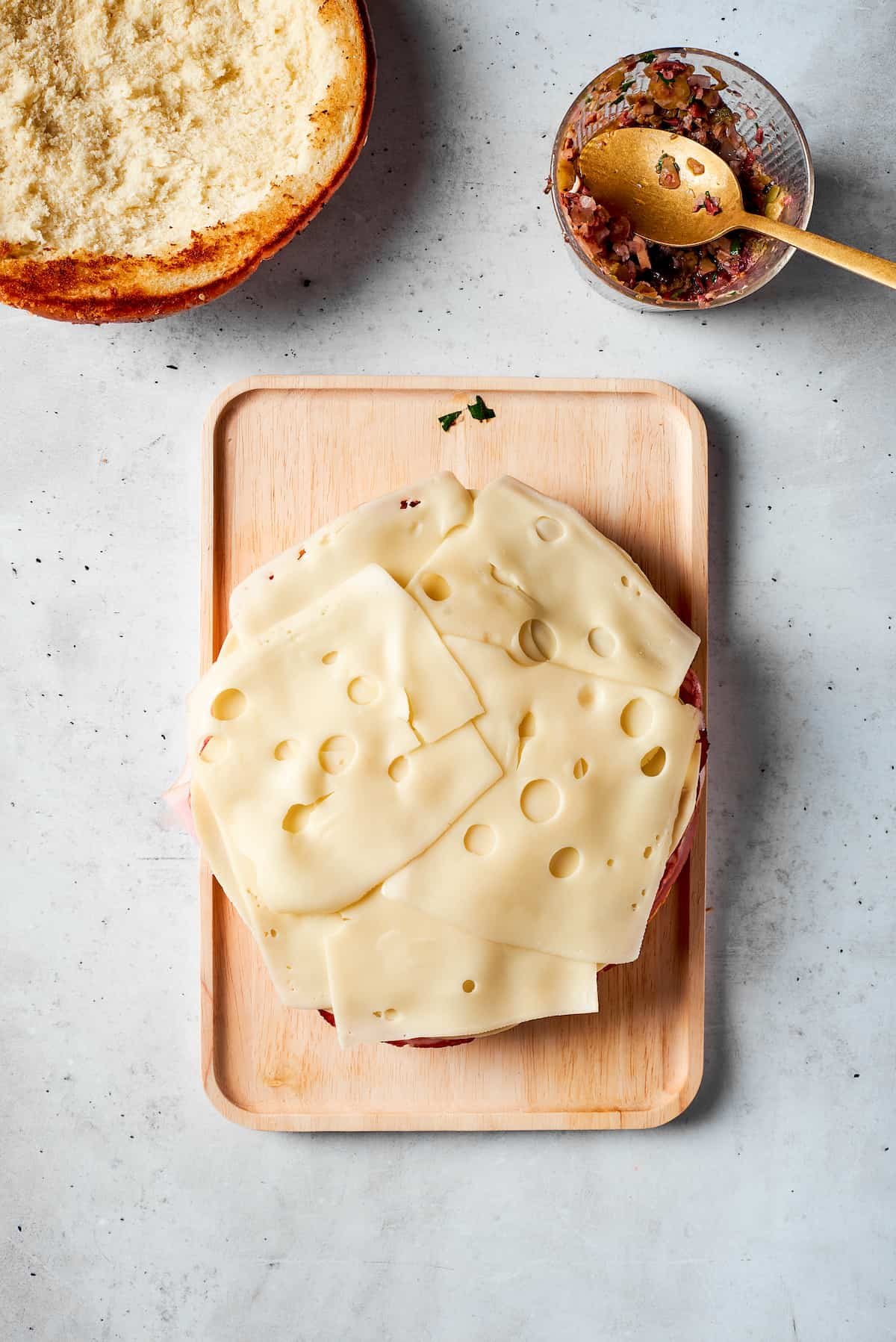 Swiss cheese slices top the sandwich.