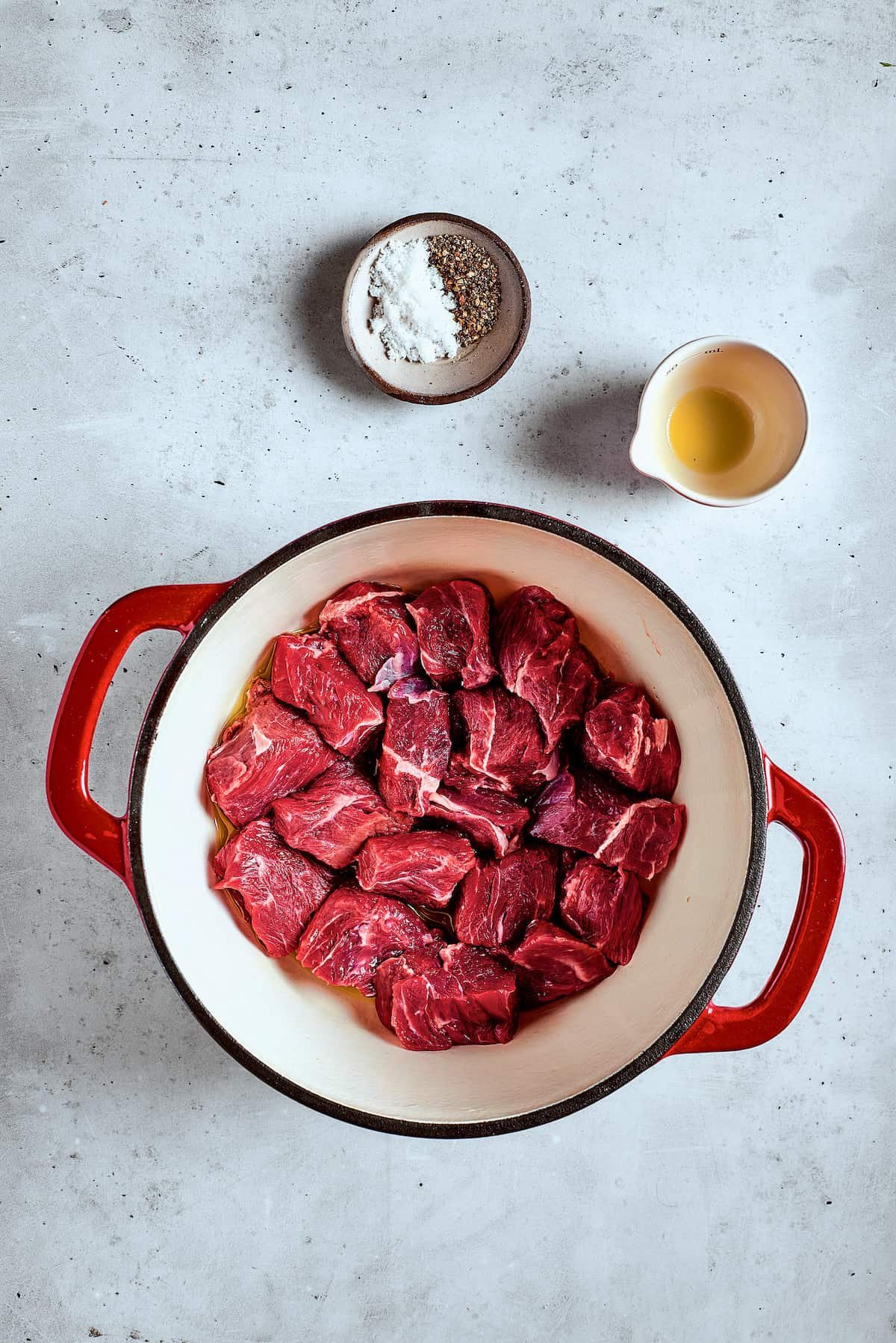 Browning beef in a soup pot.
