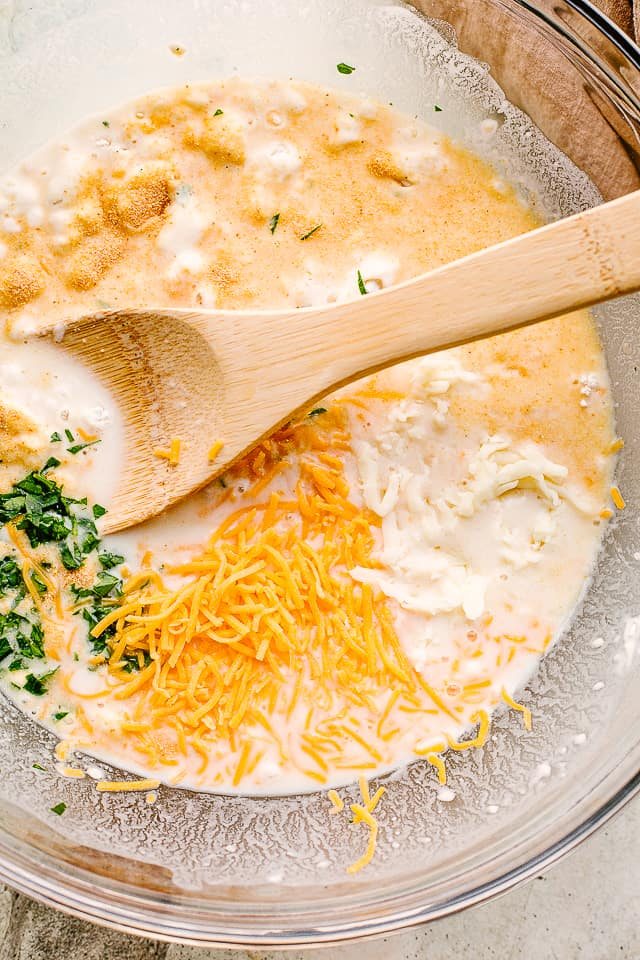 Mixing together dough ingredients.