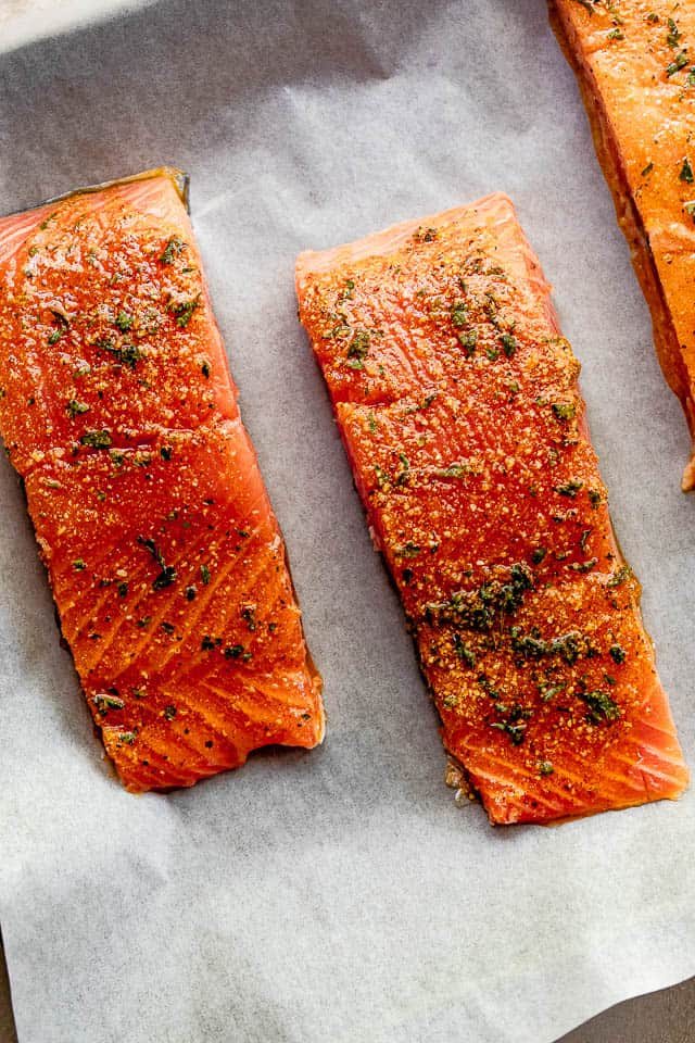 overhead shot of seasoned raw salmon fillets