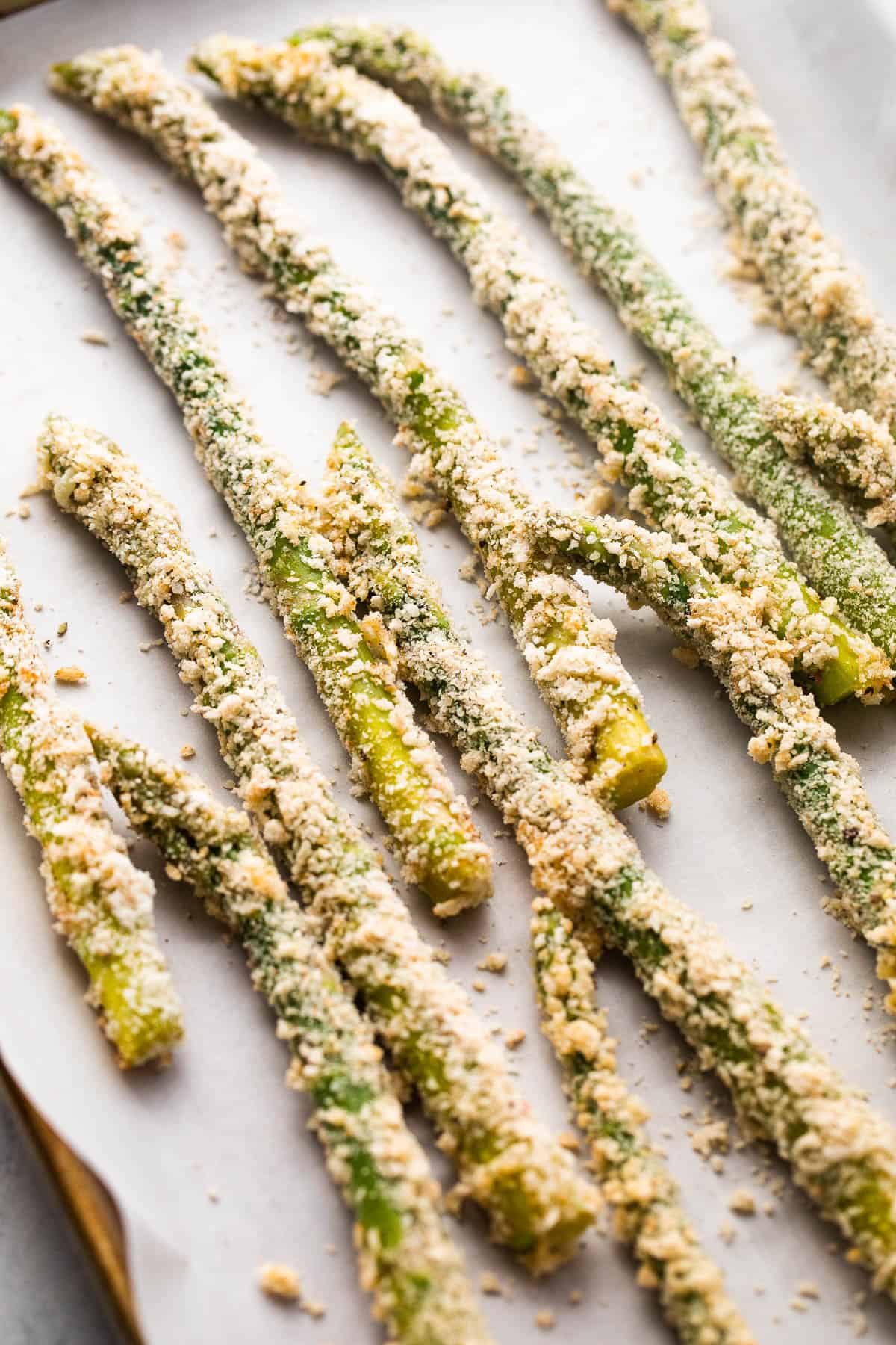 arranged fresh asparagus spears coated with parmesan panko crumbs