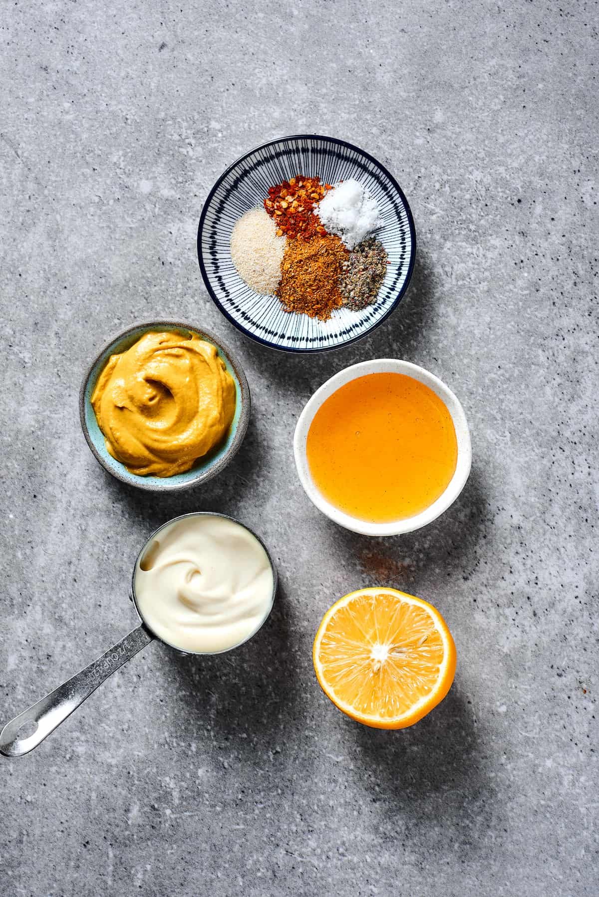 From top: Spices, honey, lemon, mayonnaise, mustard.