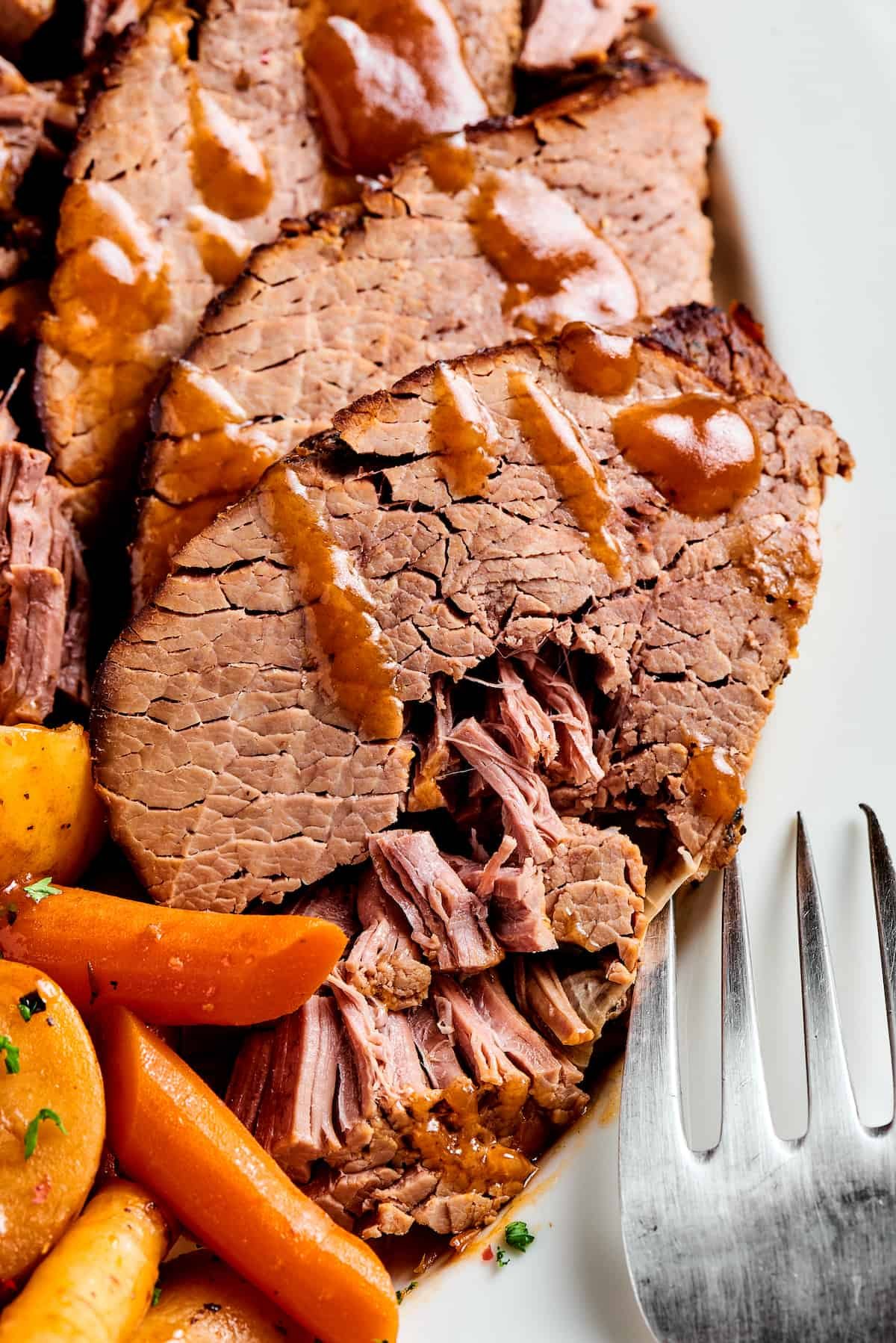 Pot roast with gravy and vegetables.