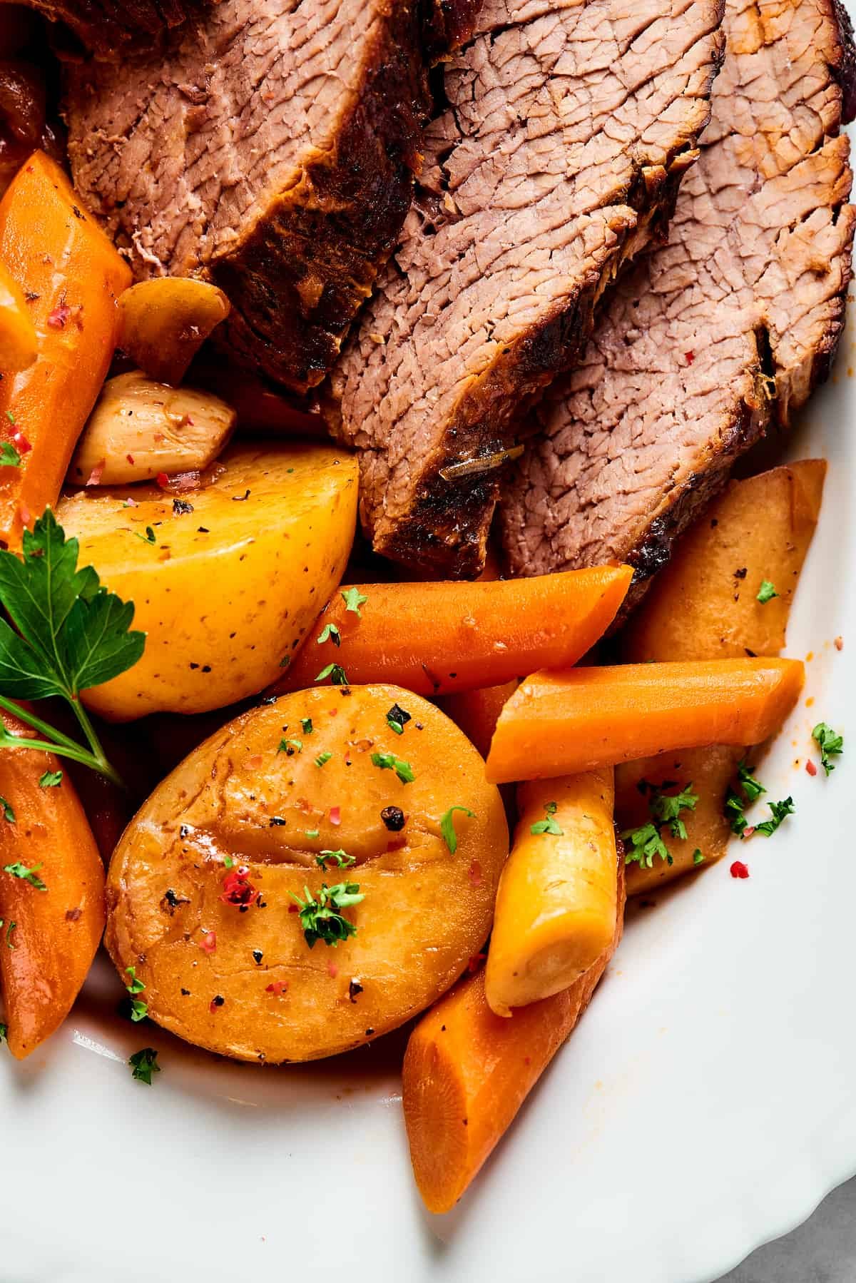 Close-up shot of pot roast and vegetables.