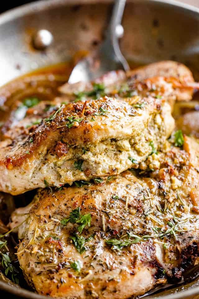side shot of pesto filling stuffed in pork chops