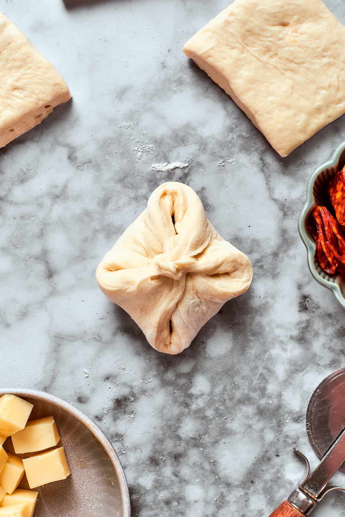 The dough is folded up around the filling.