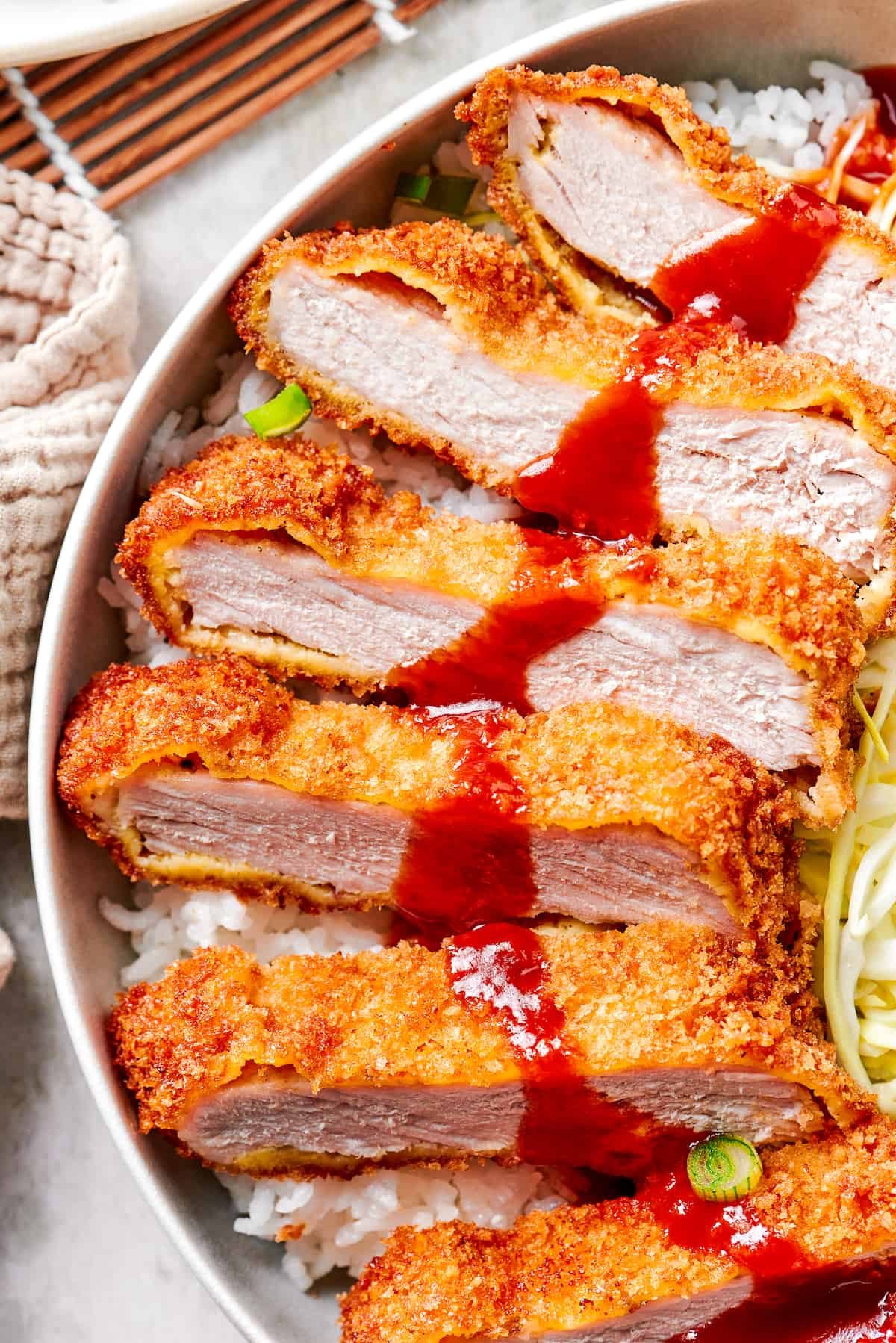A close up of sliced pork katsu.