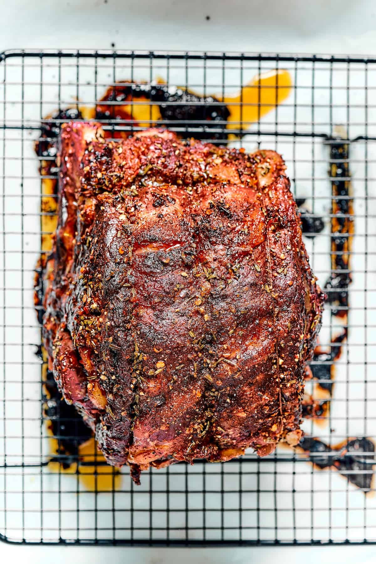 Roasted prime rib on a wire rack.