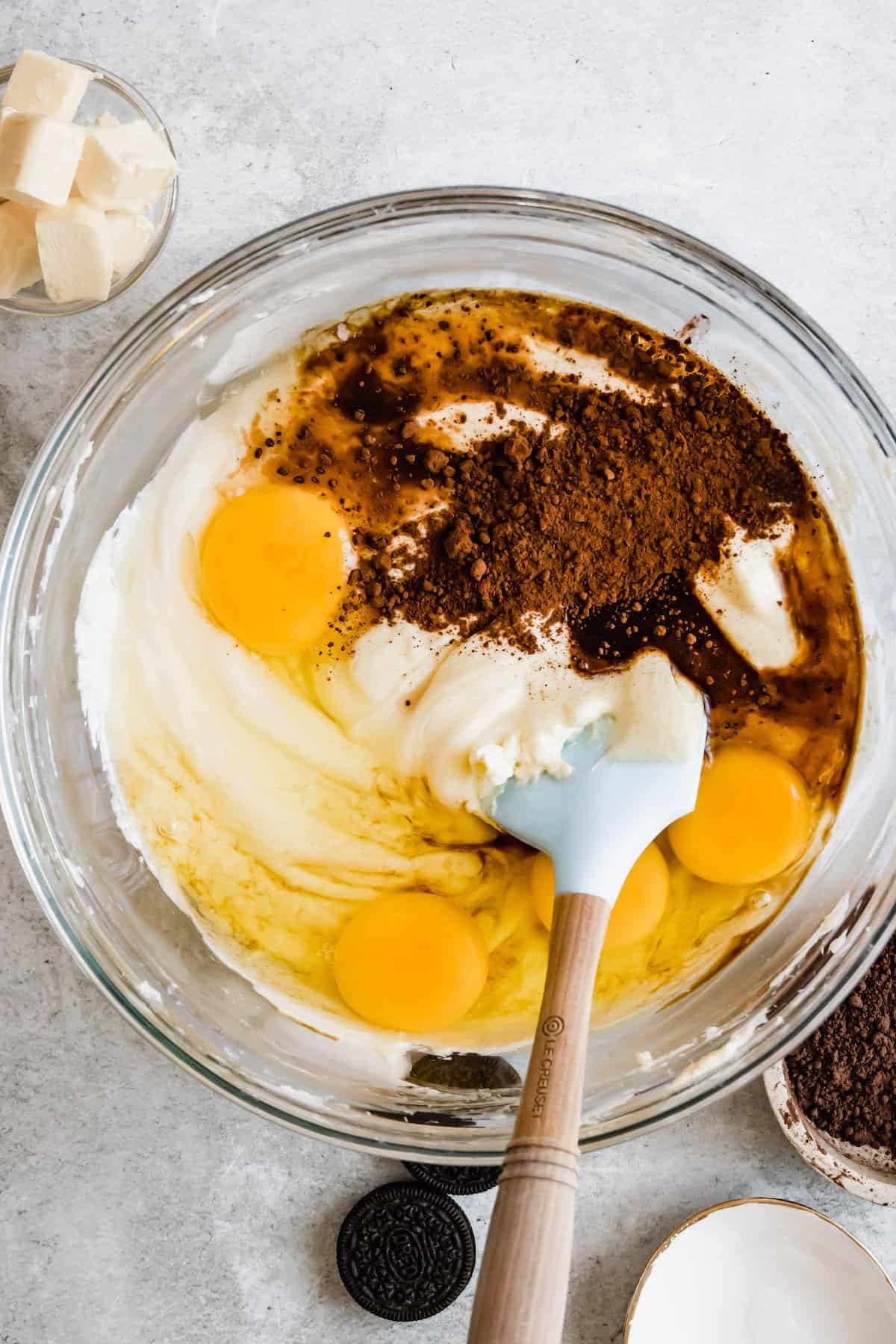 Cheesecake Batter Ingredients Being Mixed Together with a Rubber Spatula