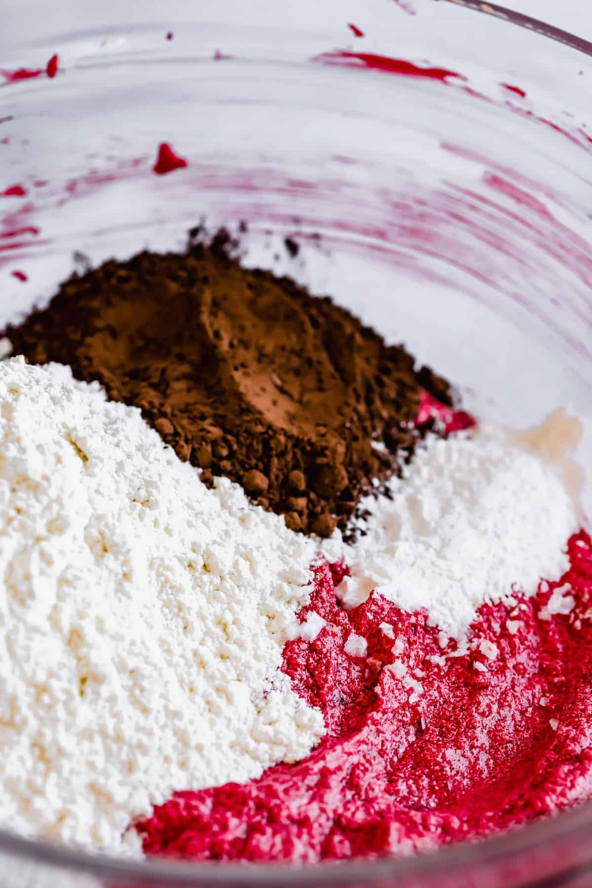 The Dry Ingredients in a Bowl with the Combined Wet Ingredients for Red Velvet Crinkle Cookies