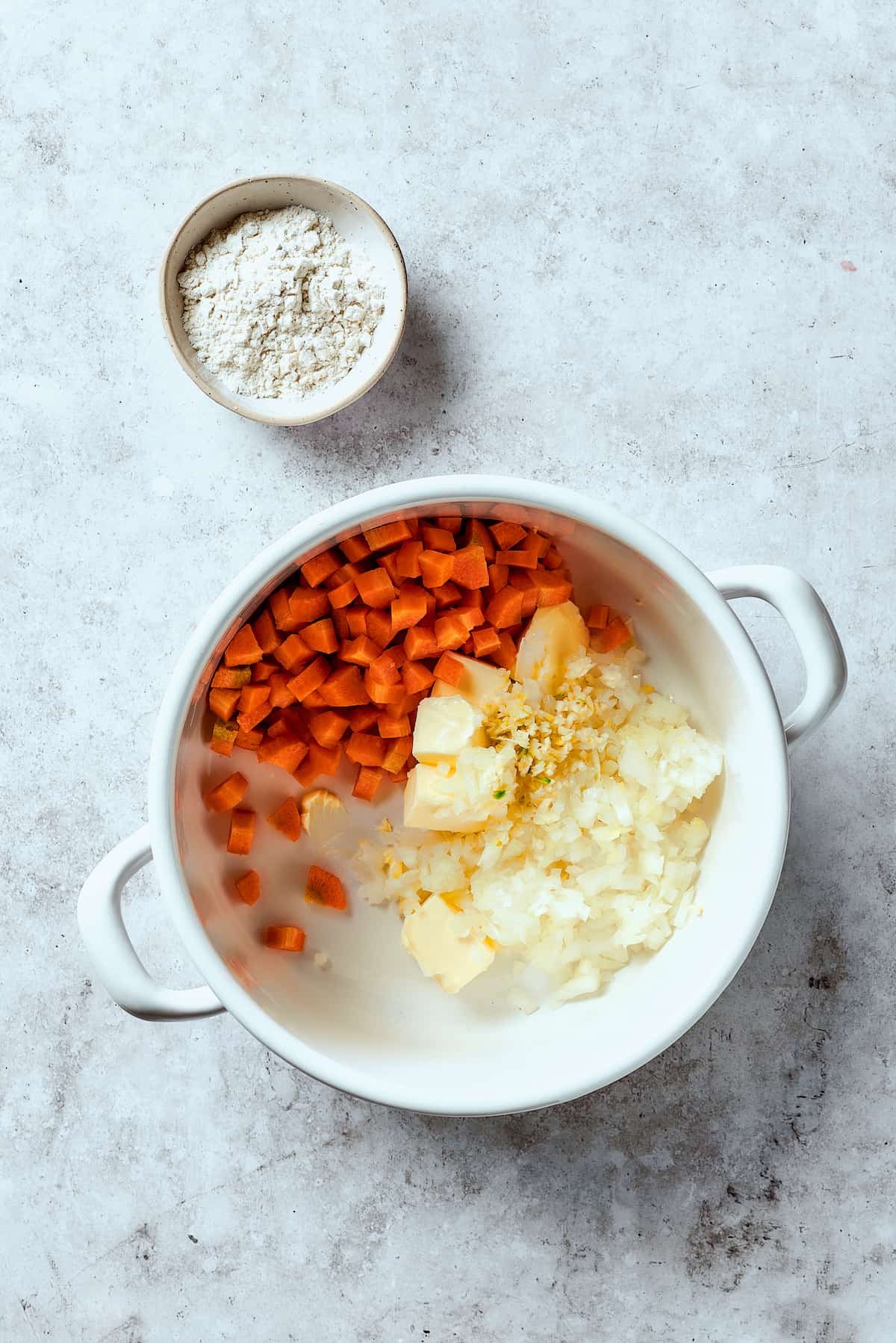 Cooking vegetables with butter in a Dutch oven.
