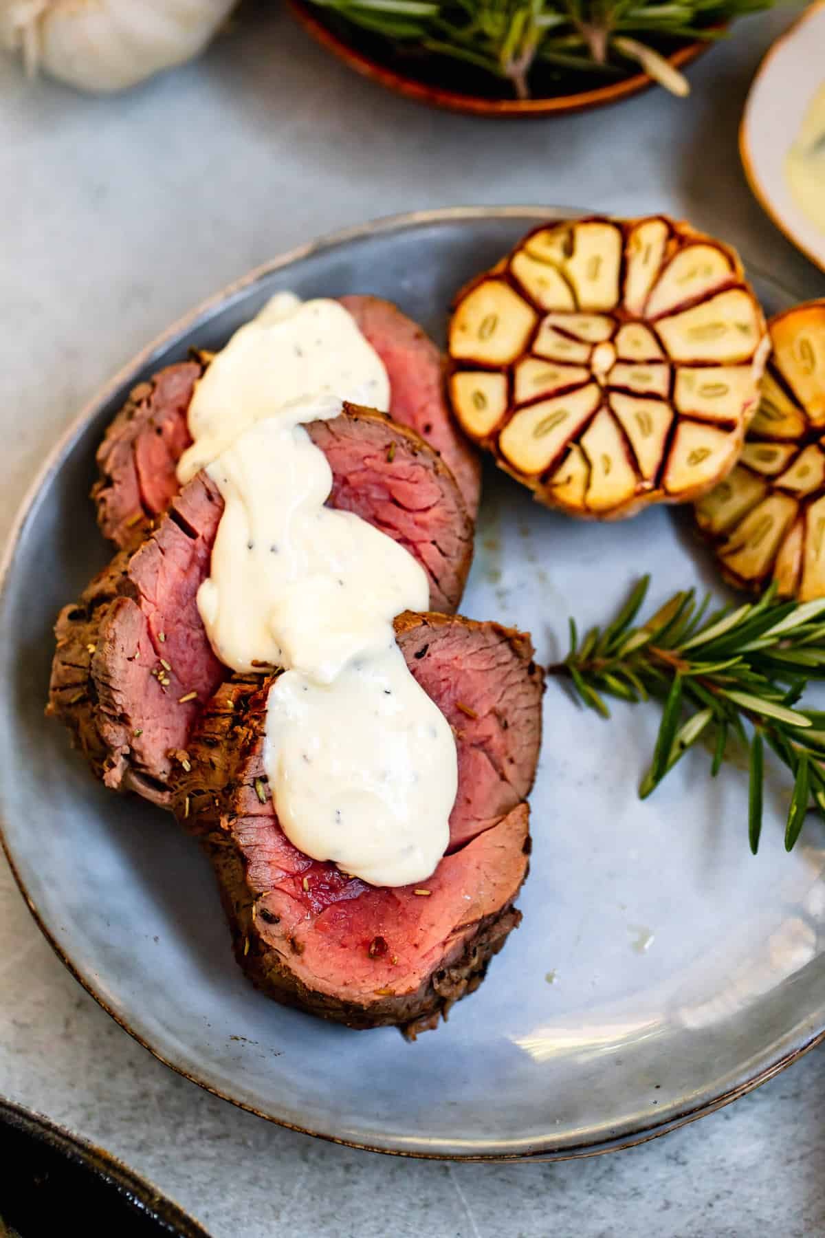 Three Slices of Juicy Beef Tenderloin Topped with Homemade Horseradish Sauce