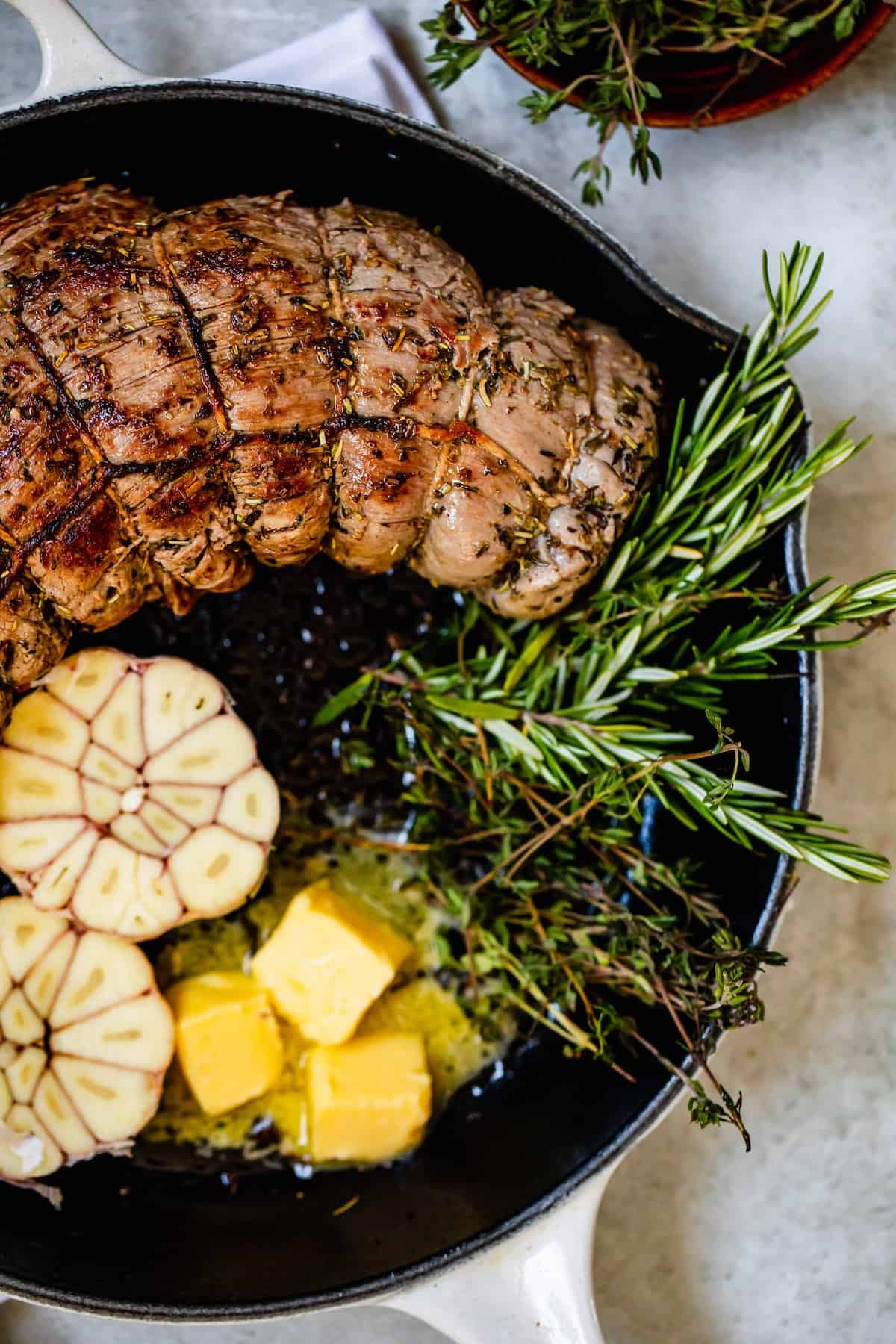 Melty Butter in a Saucepan with Roast Beef and Rosemary Sprigs