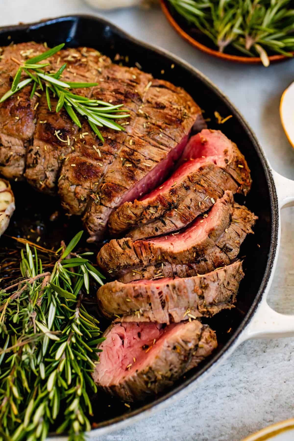 Slices of Homemade Roast Beef Tenderloin Inside a Metal Skillet