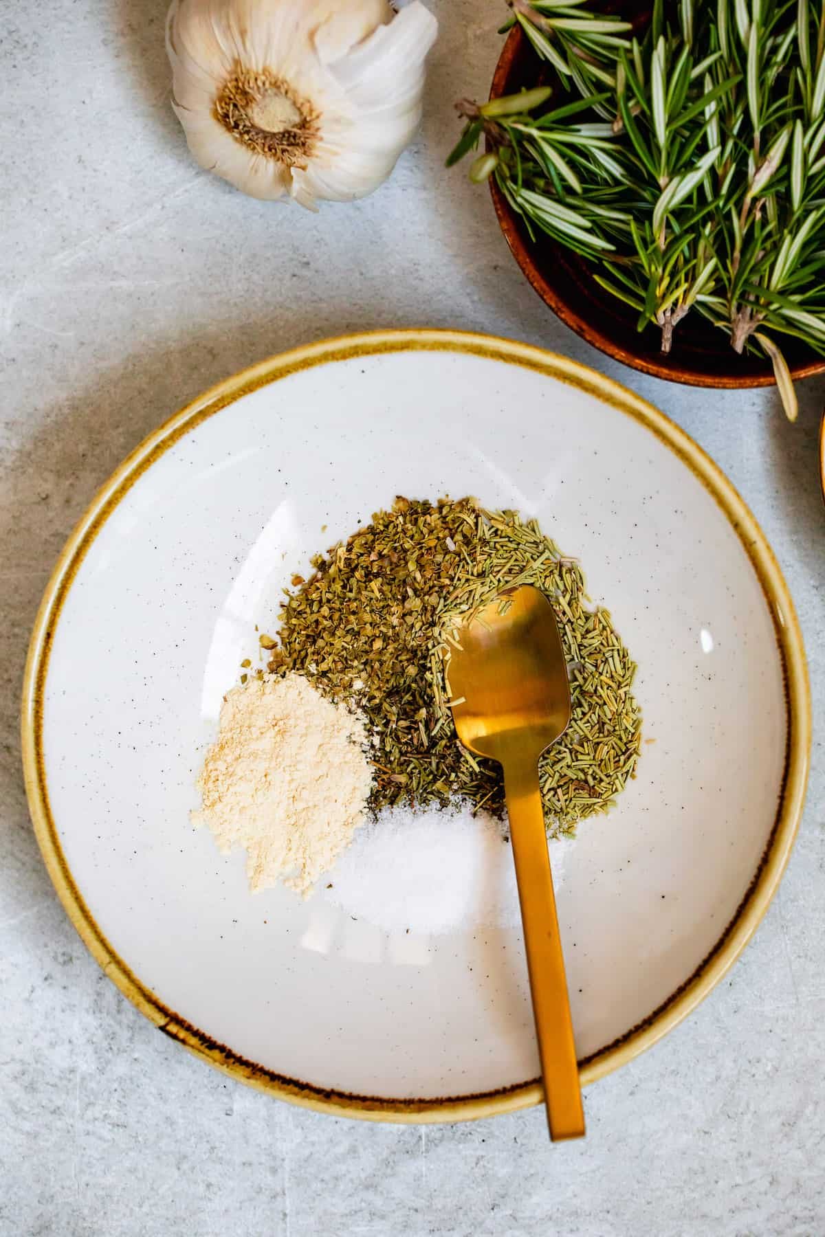 Seasoning herbs in a gold trimmed plate