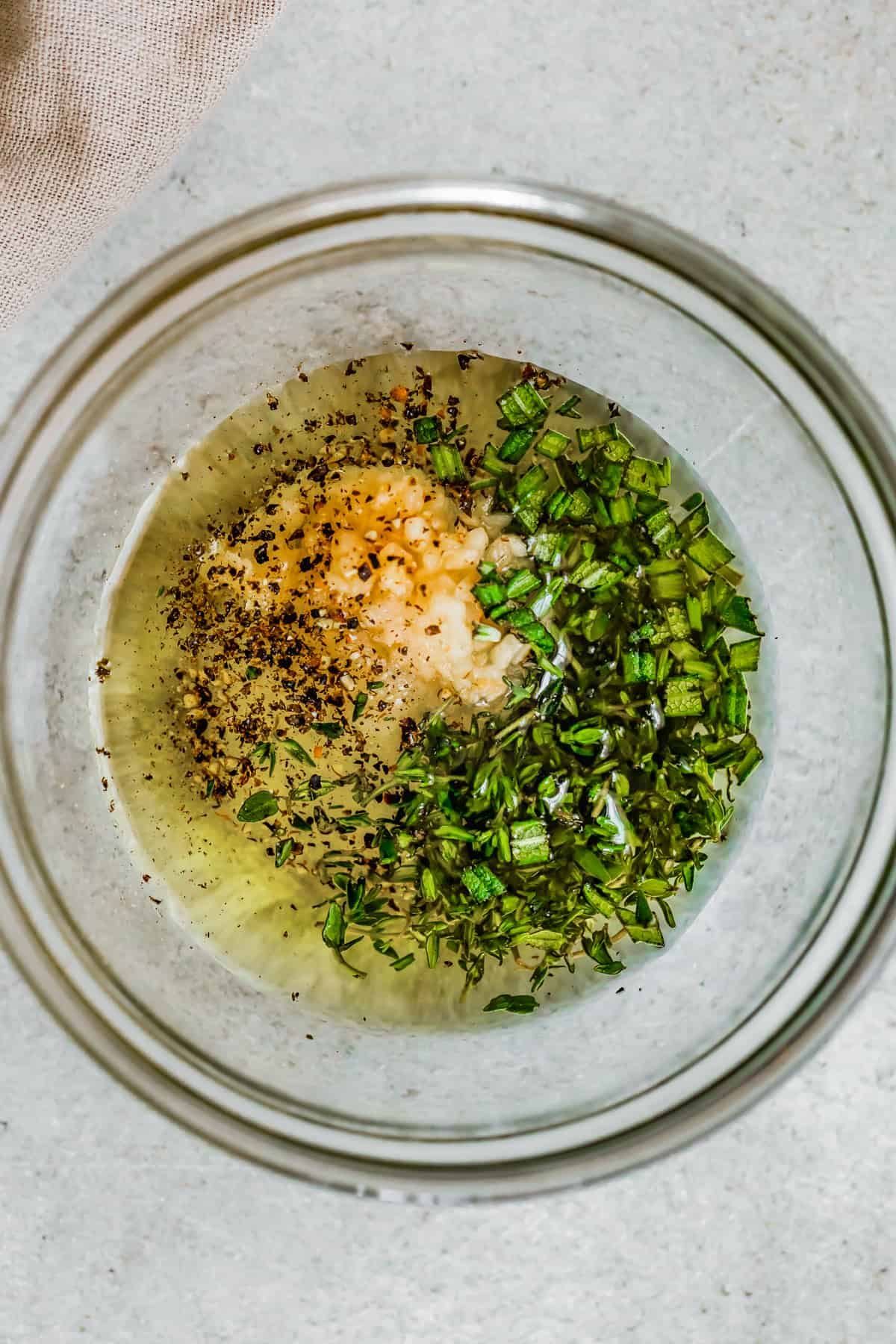 Seasonings and liquids in a mixing bowl.