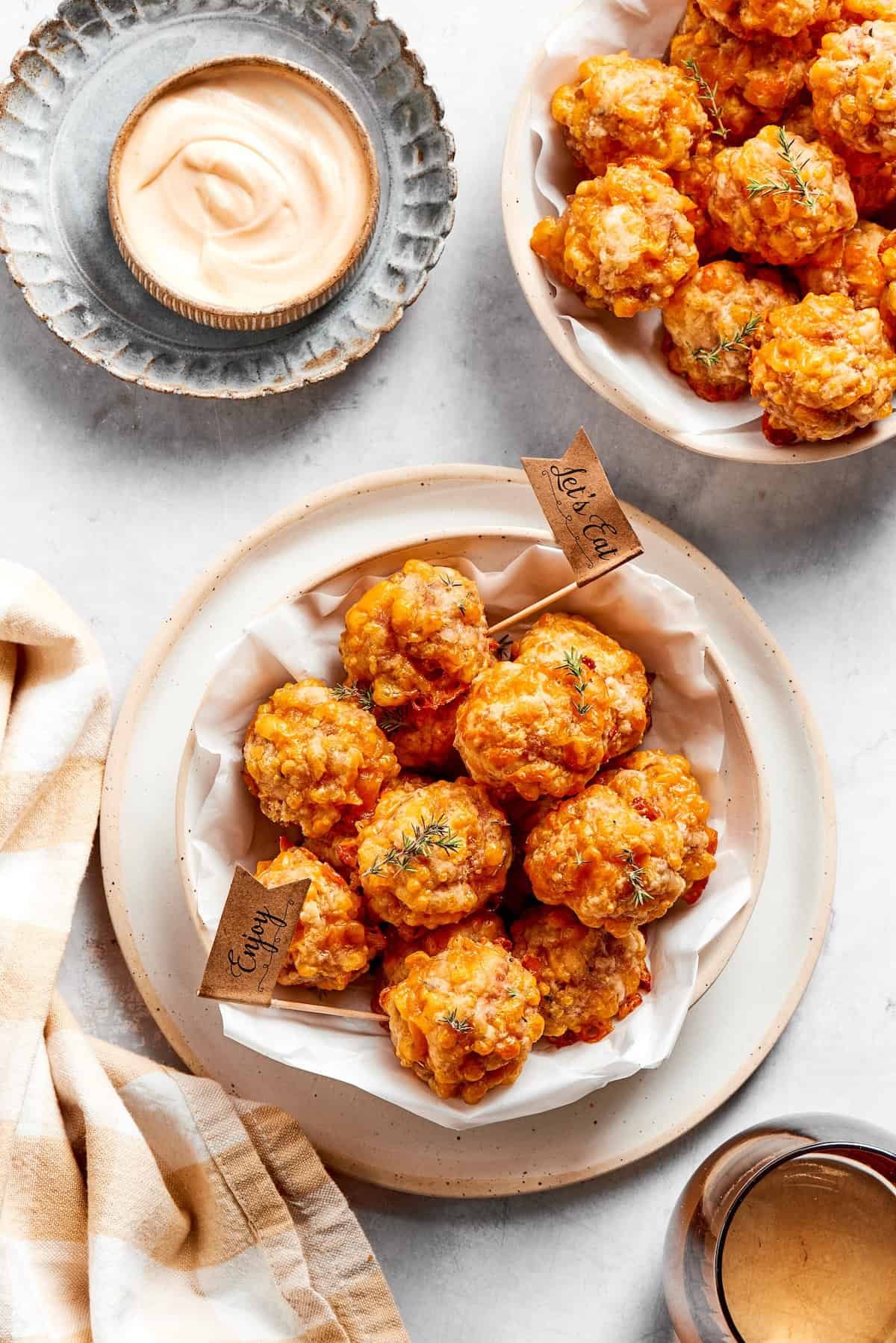 Bowls of sausage balls and dip.