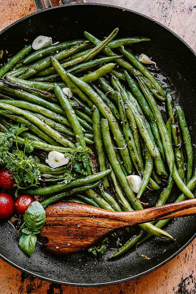 green beans cooking in a black skillet