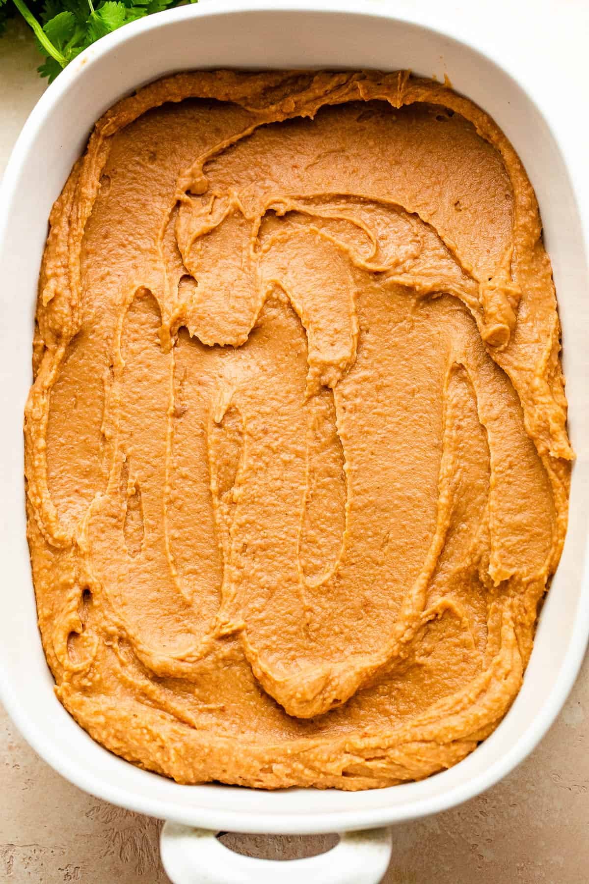 refried beans layer for a seven layer mexican dip