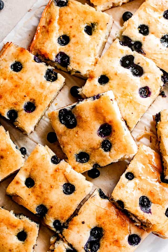 sheet pan pancakes topped with blueberries and cut into squares