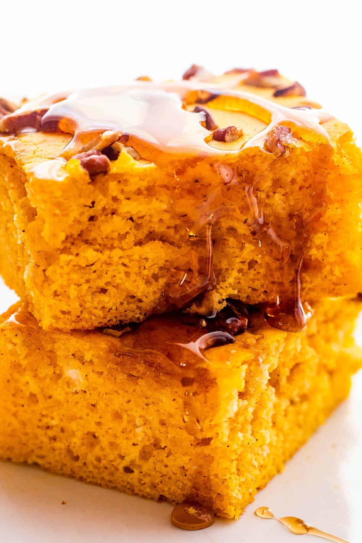 two pumpkin pancakes stacked one on top of the other