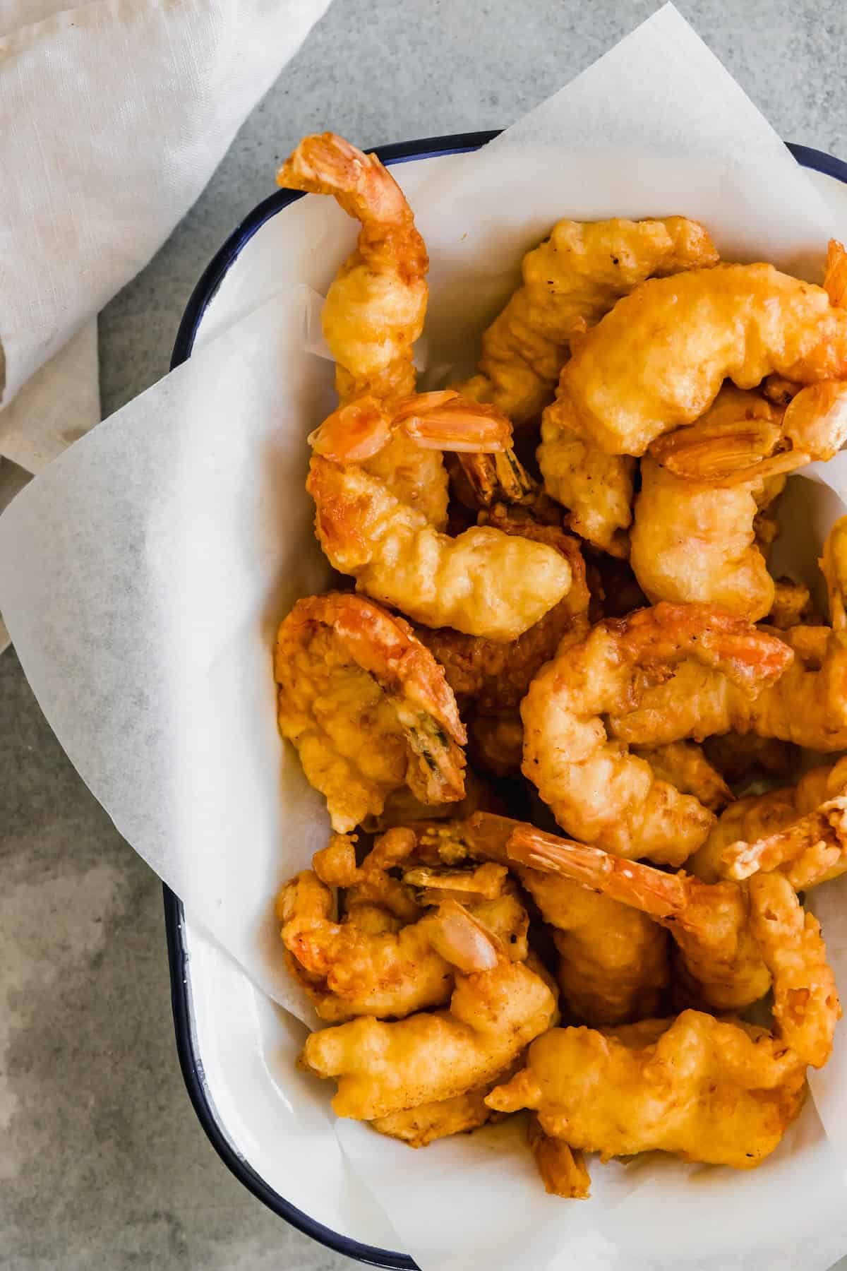 A Platter of Shrimp Tempura Lined with a Piece of Parchment Paper