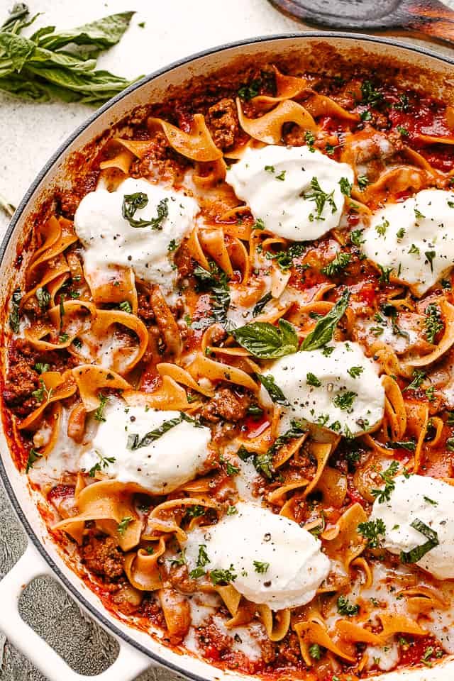 Skillet Lasagna with cheese and fresh herbs.