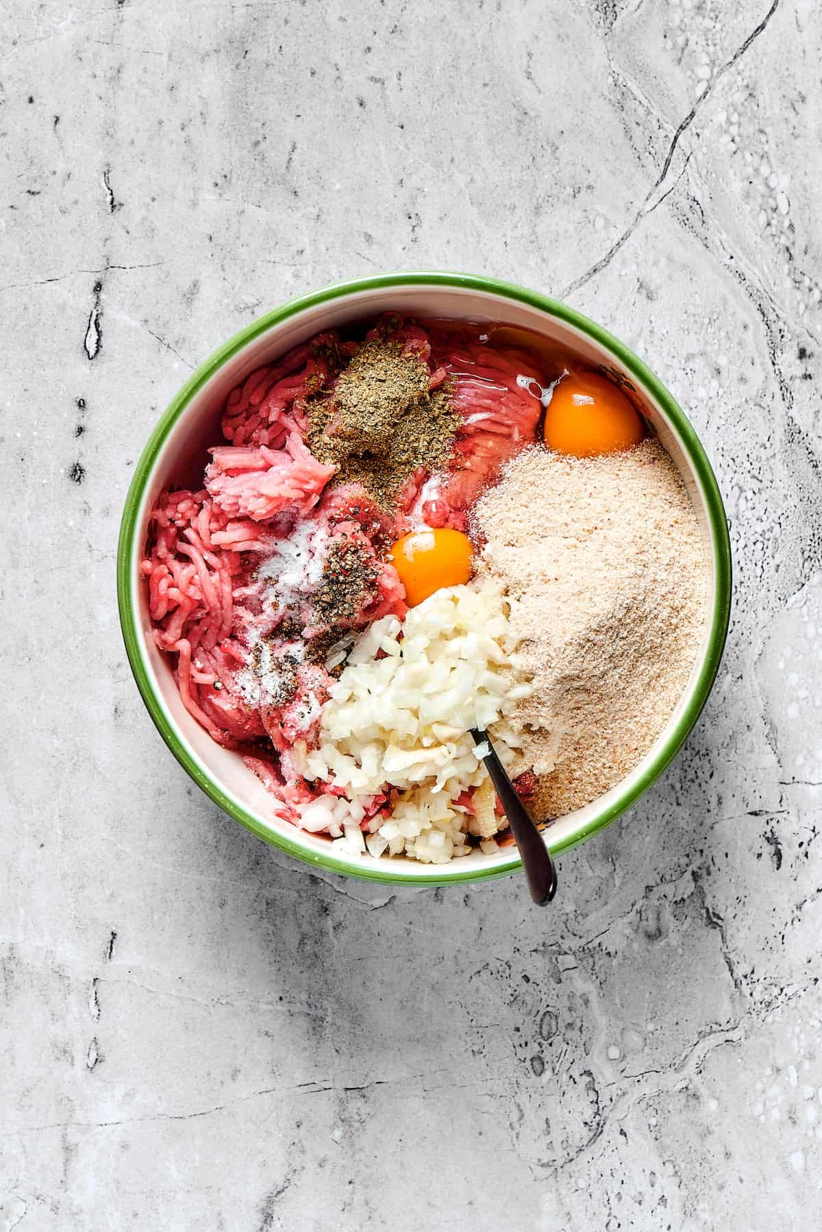 Meatball ingredients in a mixing bowl.