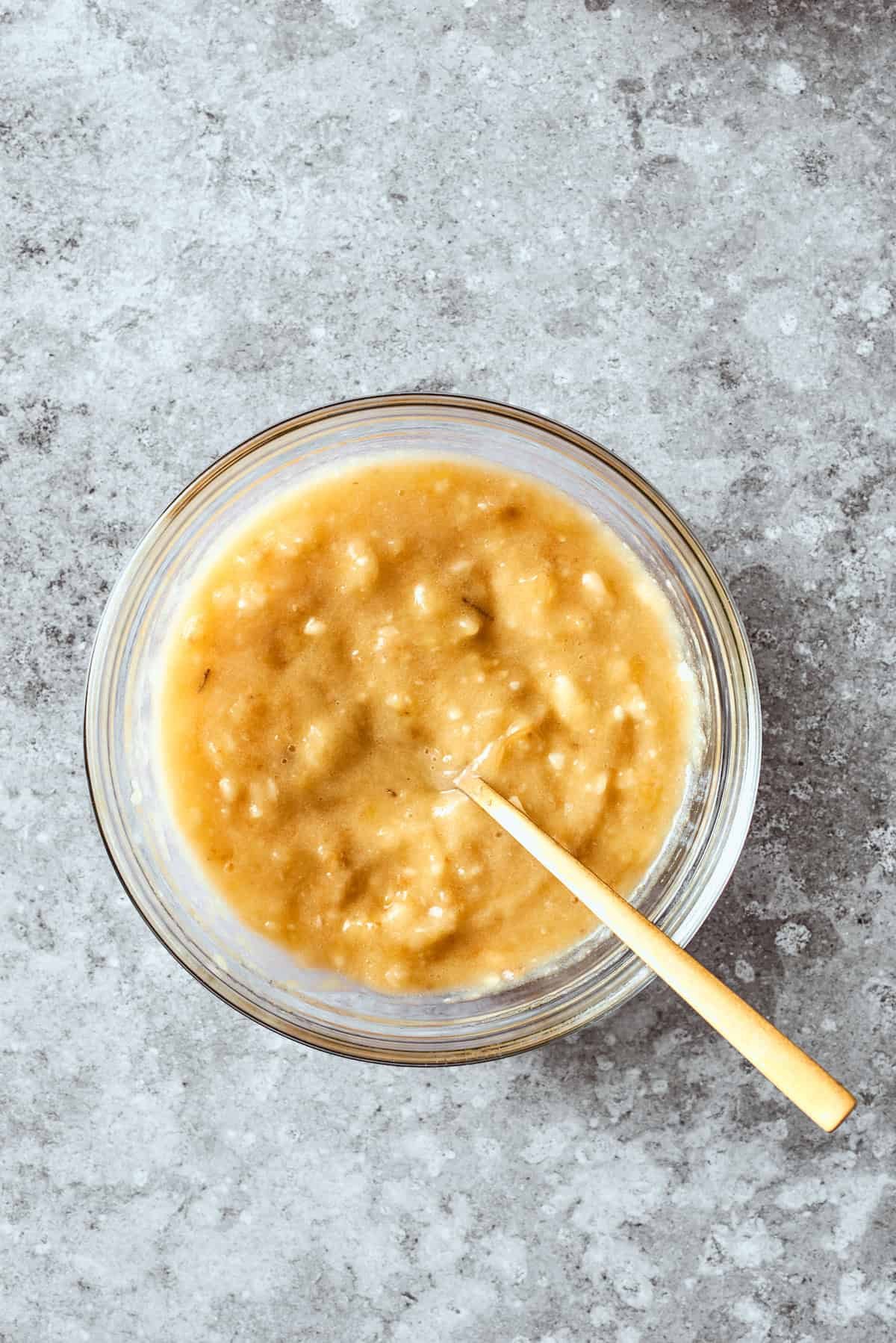 The mashed bananas are added to the wet mix.