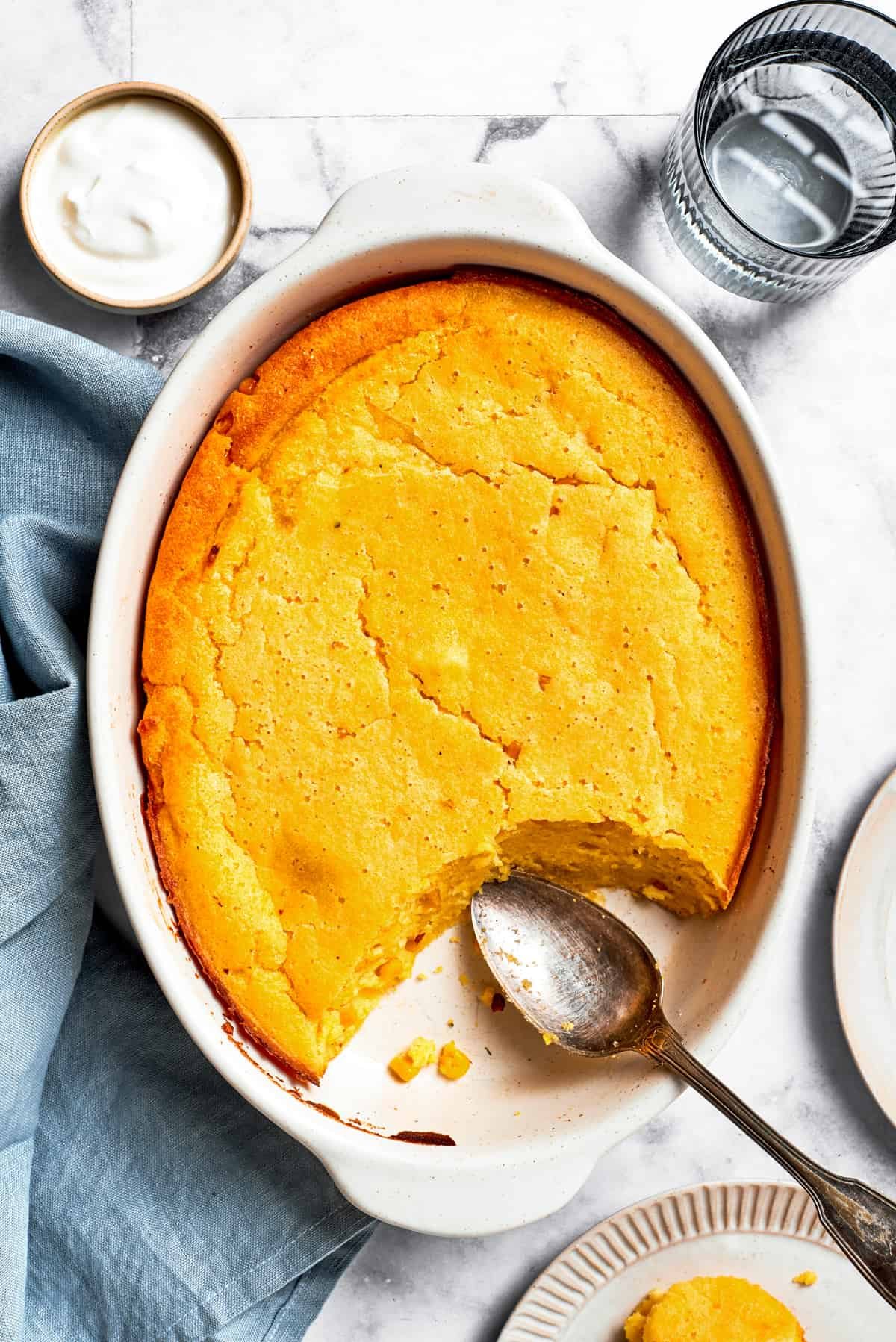Overhead image of a baking dish with baked Spoon Bread.