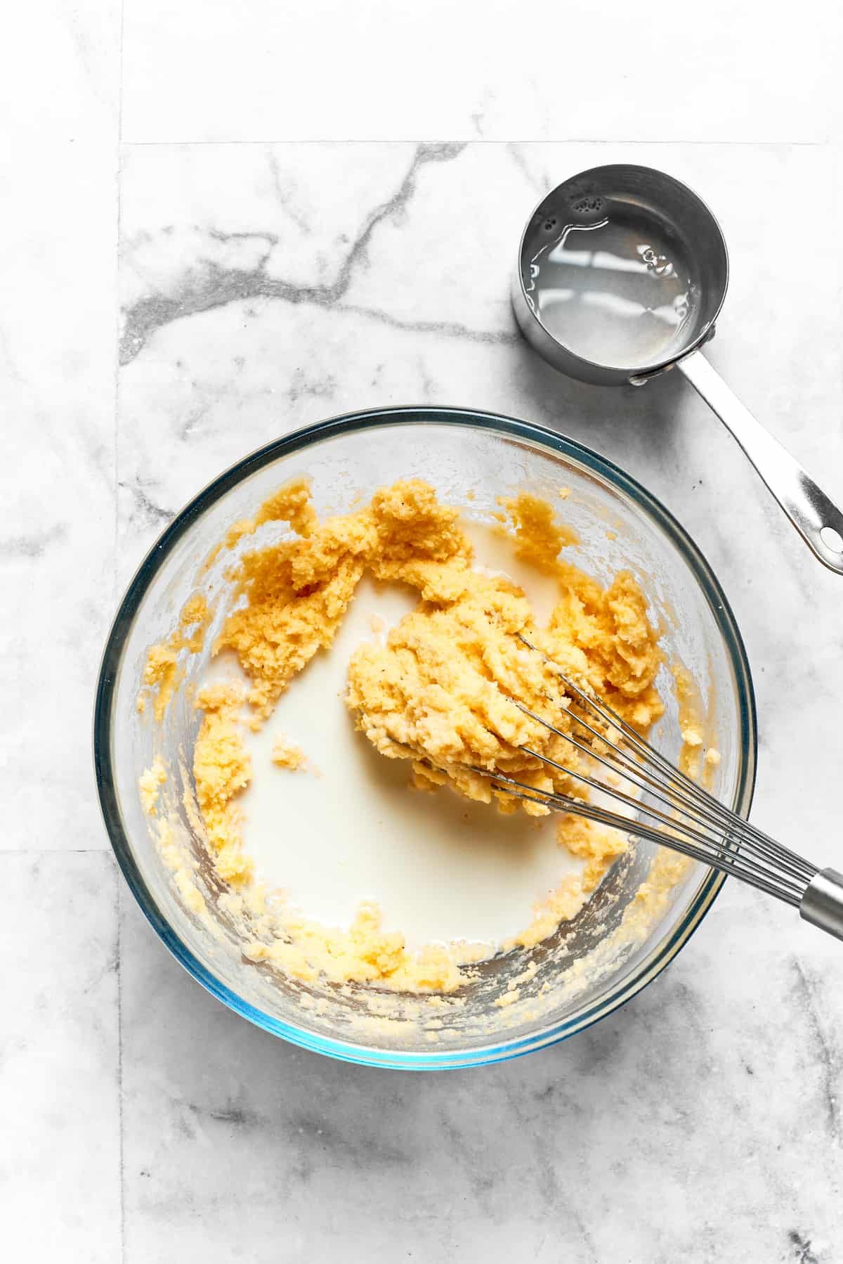 The milk is whisked into the batter for spoon bread.