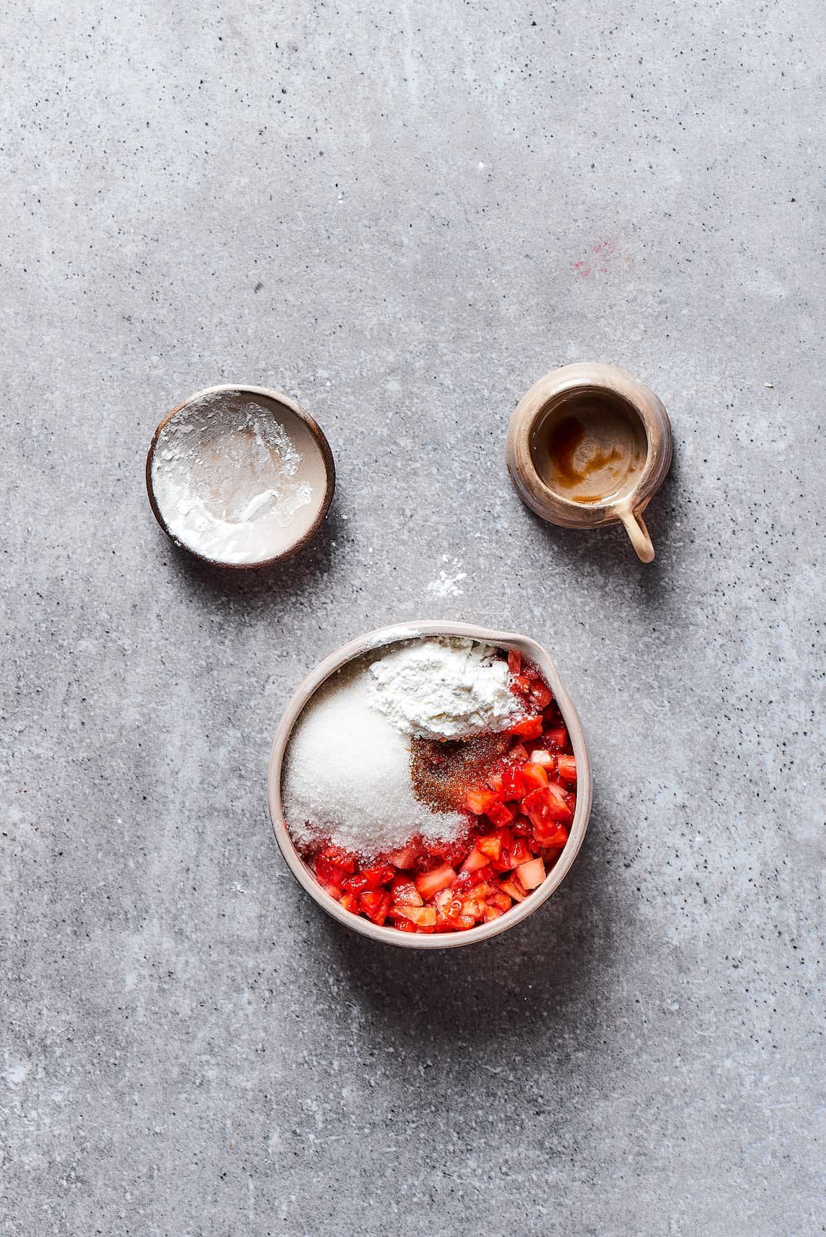 Mixing strawberry filling ingredients.