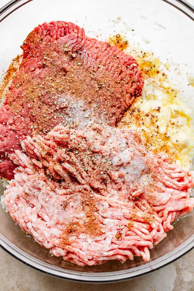 glass bowl filled with ingredients for meatballs