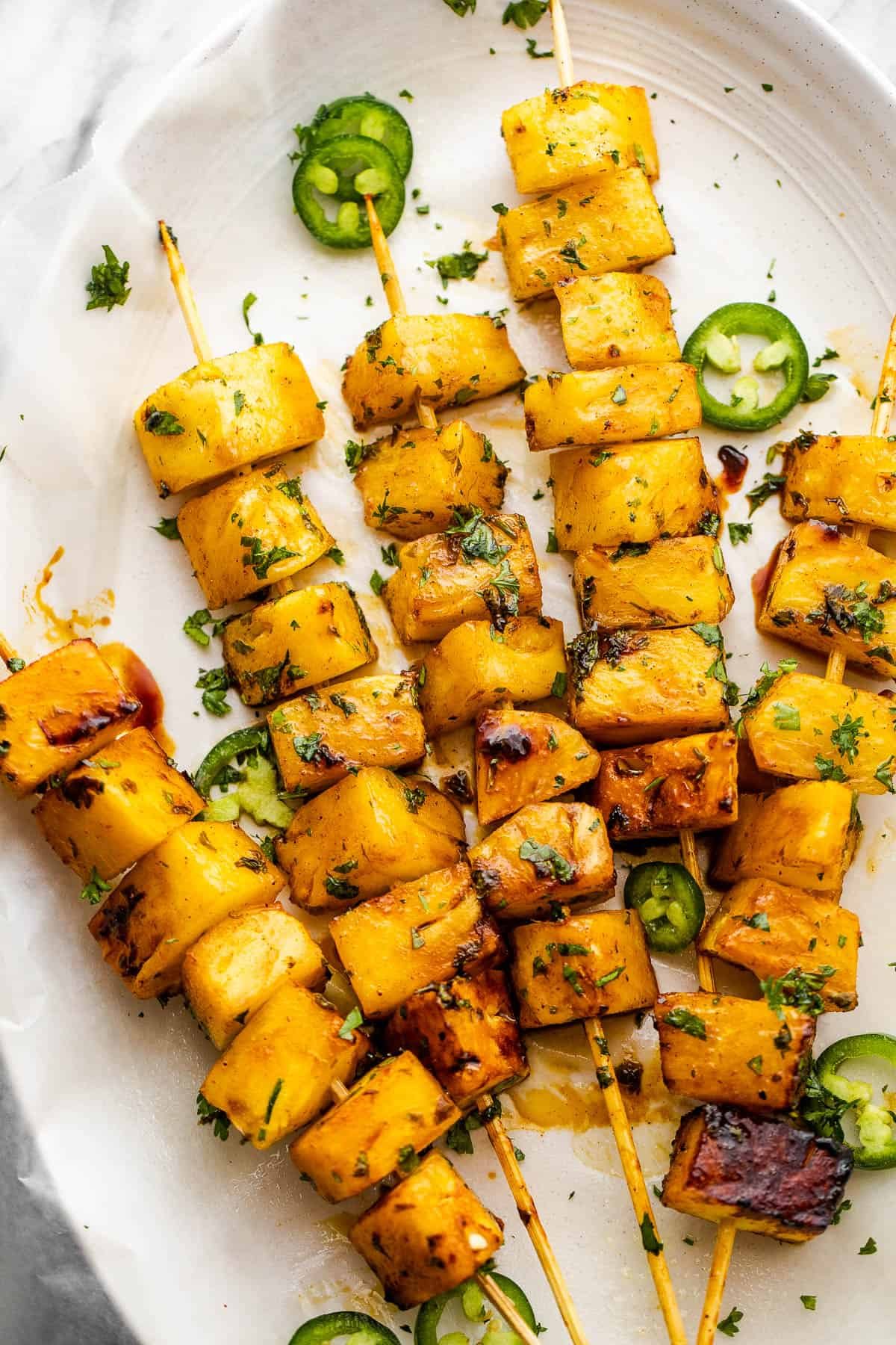 five skewers with pineapples