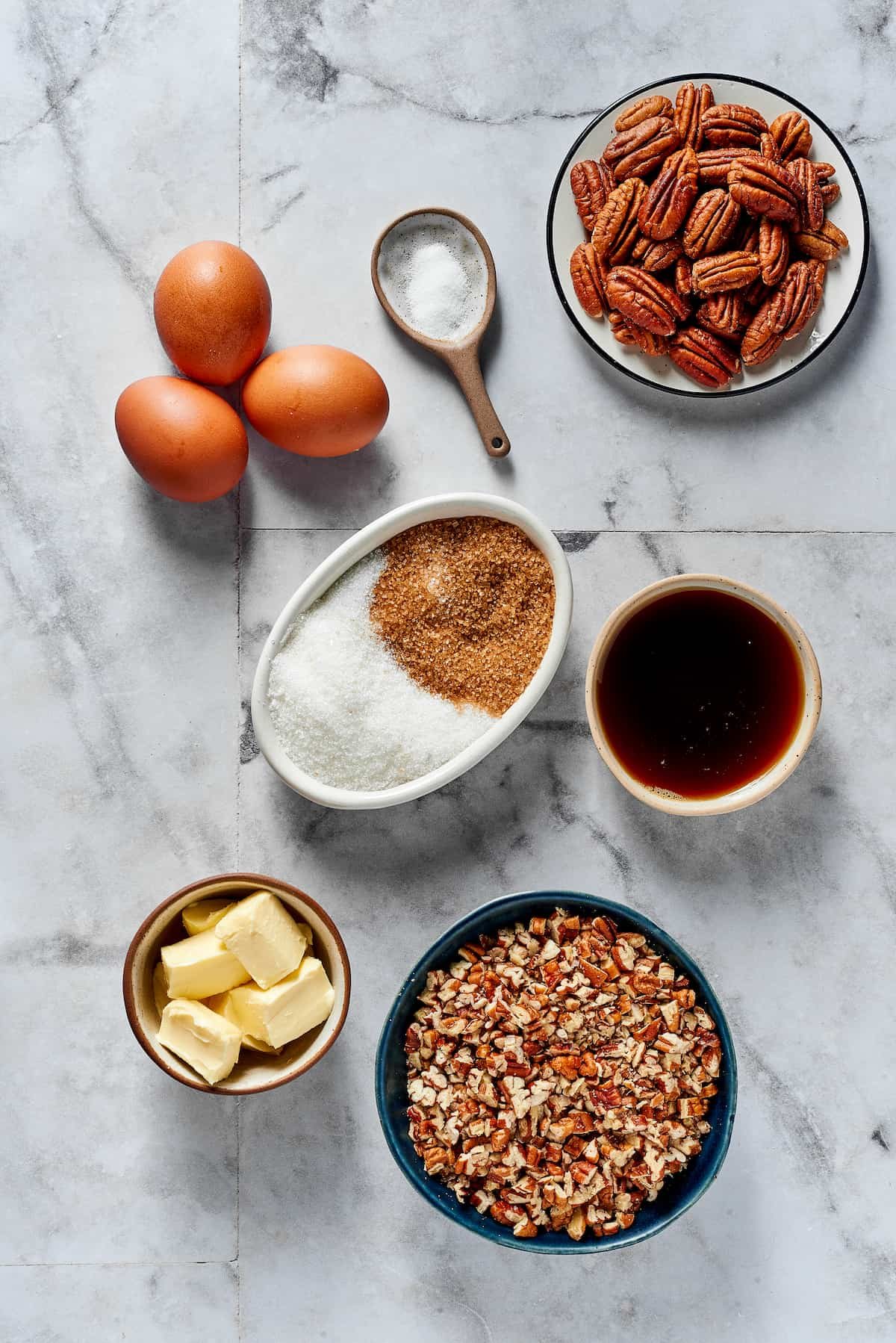 From top left: Eggs, salt, pecans, white and brown sugar, maple syrup, butter, chopped pecans.