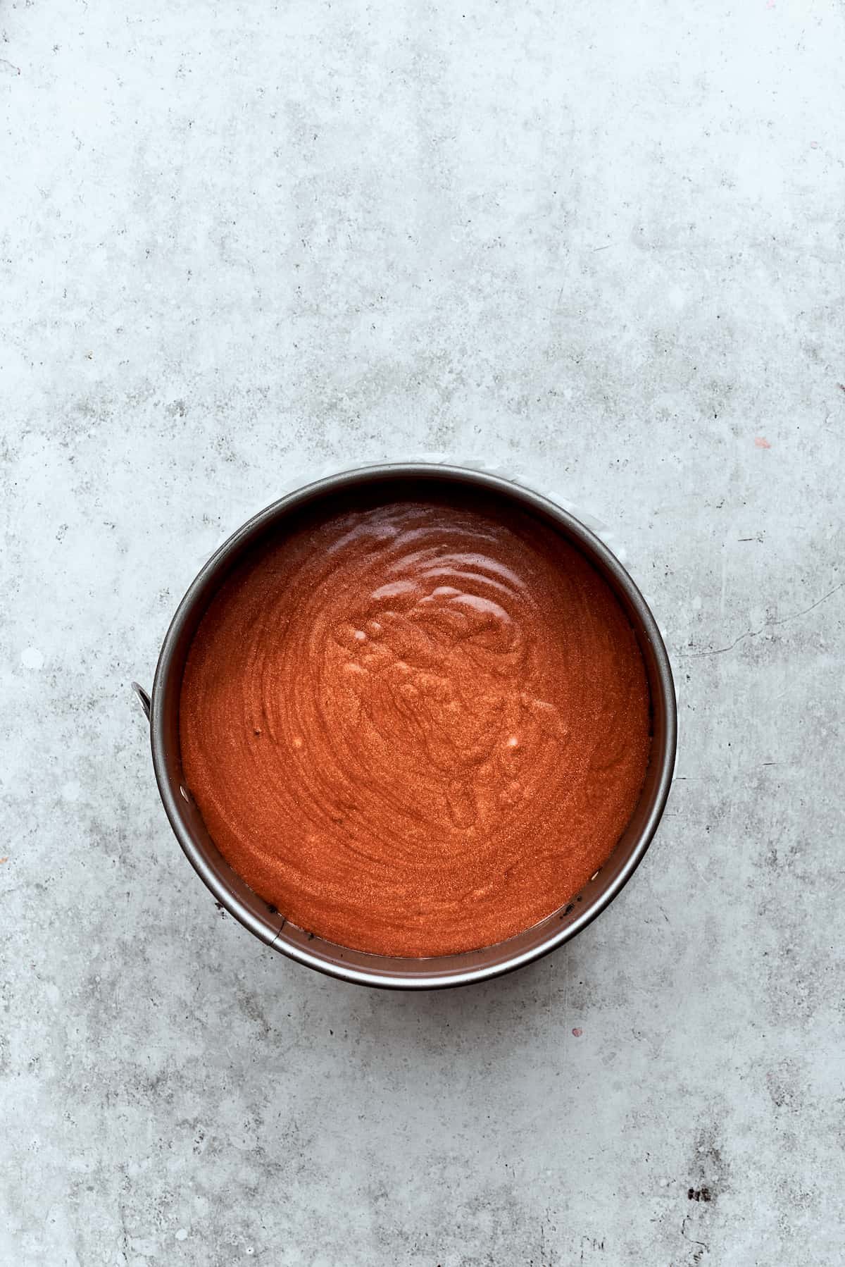 The chocolate cheesecake filling layer tops the caramel-pecan layer.
