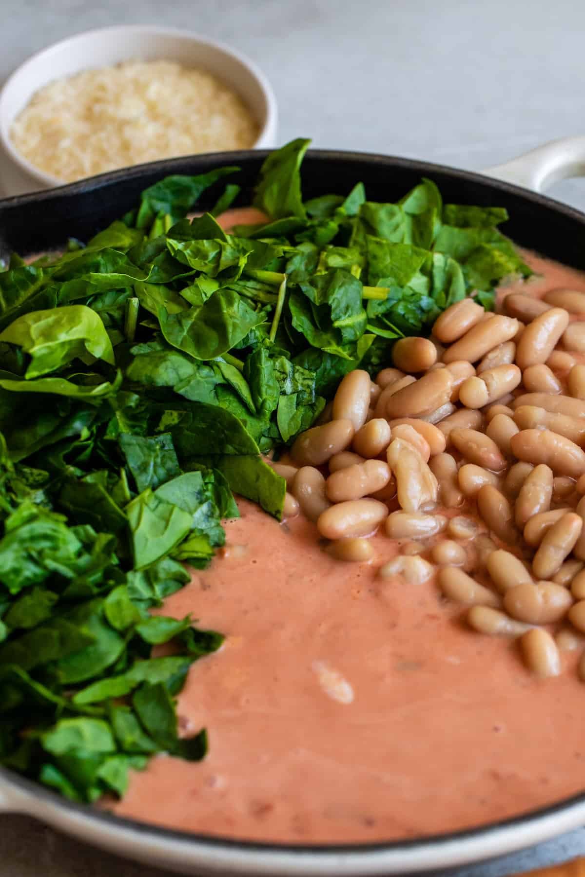 Spinach and Beans Added to the Skillet of Tuscan Rigatoni Sauce